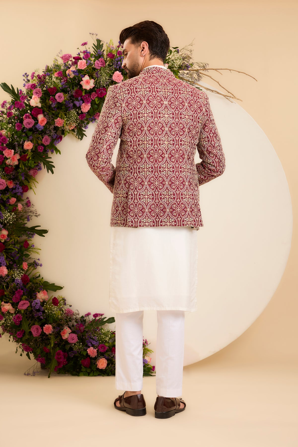 A Maroon Bandhgala Richly Embellished with threadwork
