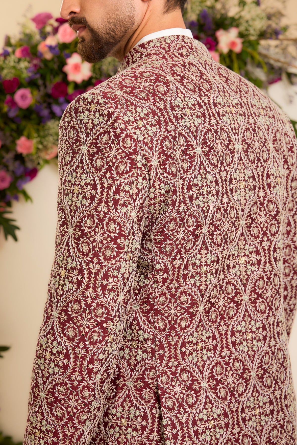 A Maroon Bandhgala Richly Embellished with threadwork