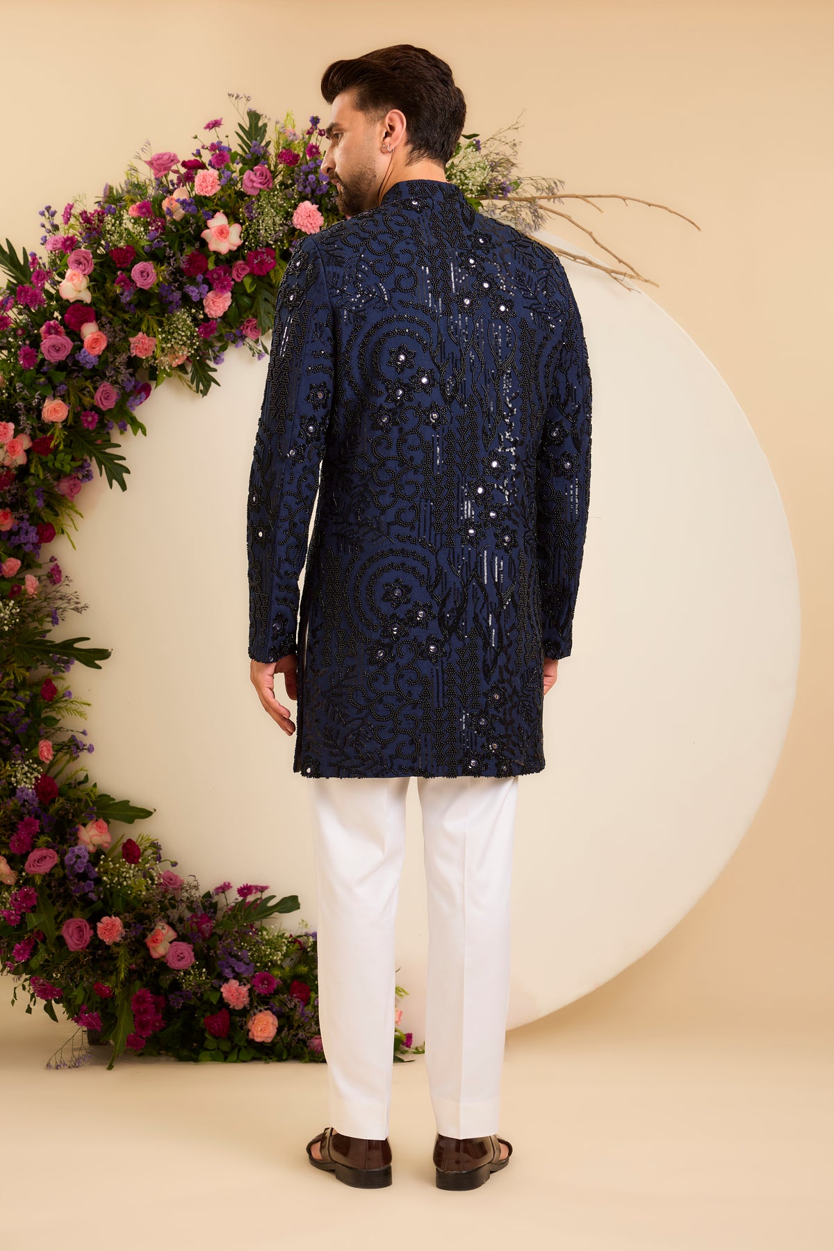 A Navy Short Sherwani Richly Worked in Cut-Dana and Beads