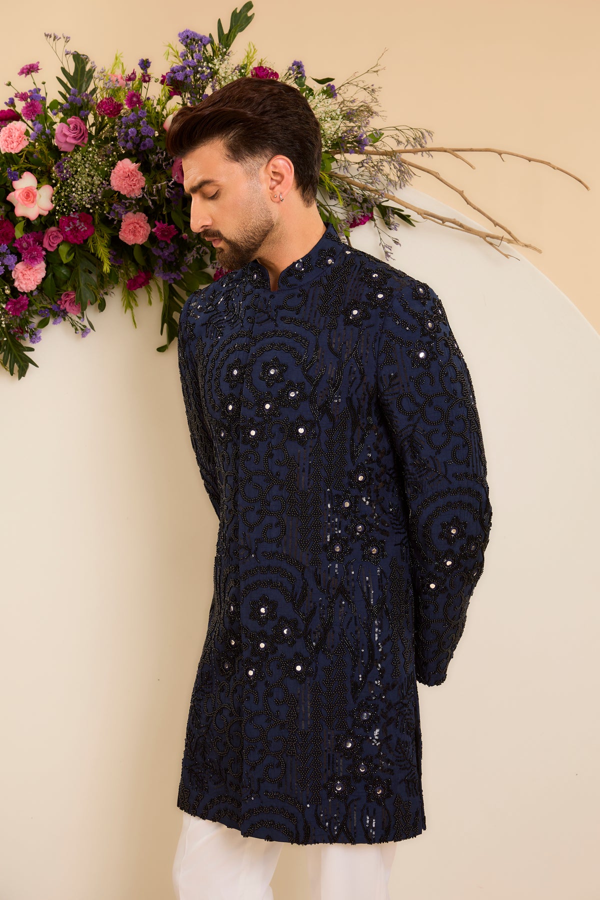 A Navy Short Sherwani Richly Worked in Cut-Dana and Beads