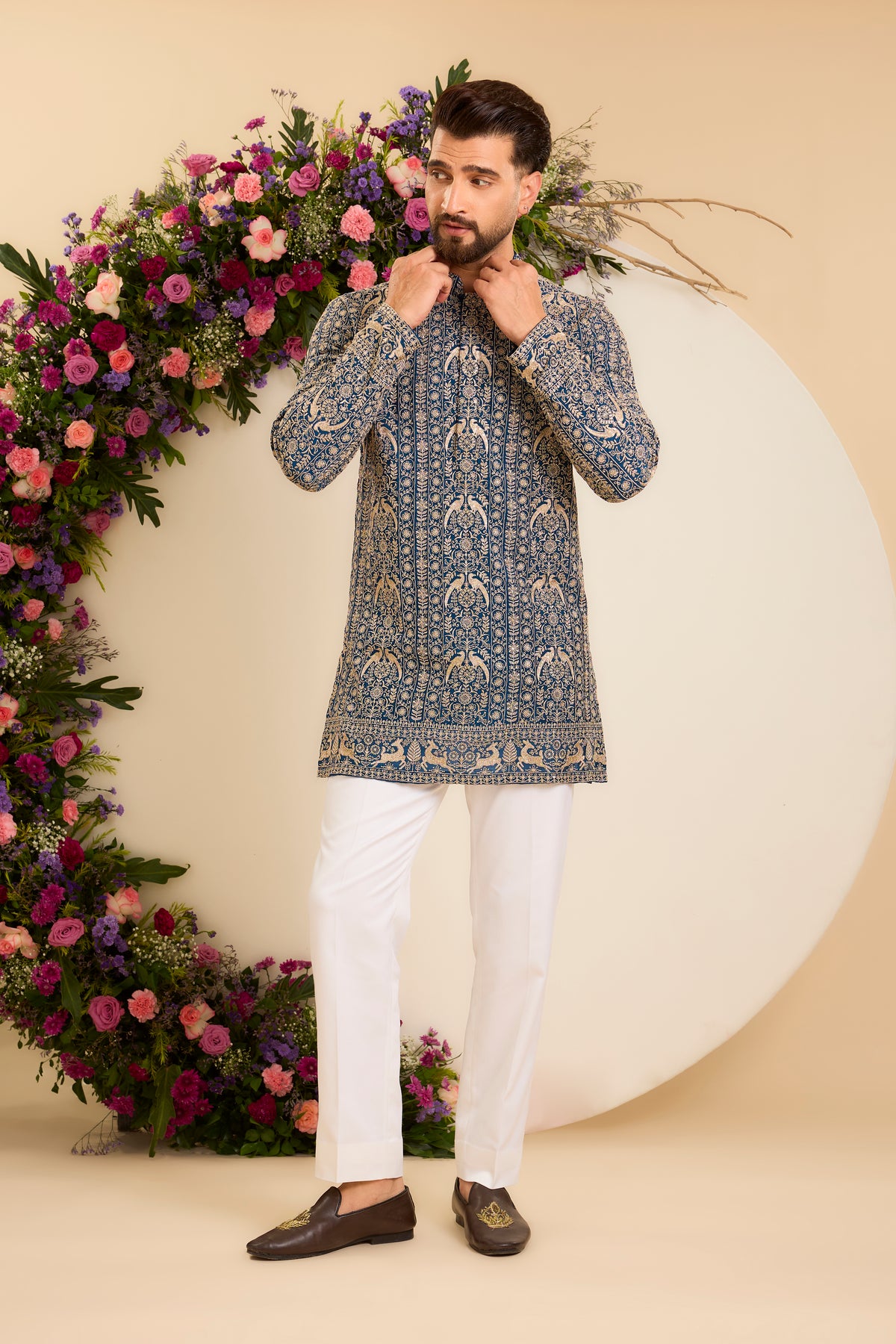 A Regal Blue short Kurta Woven with Ornate Zari Details