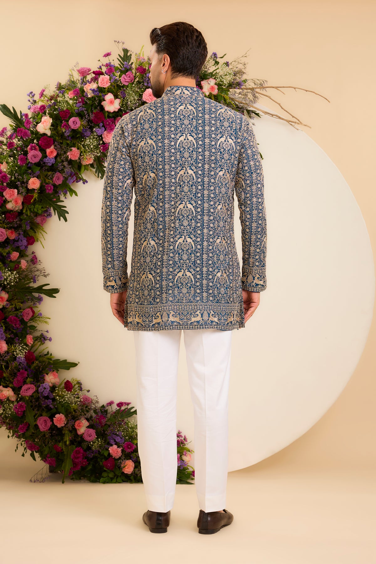 A Regal Blue short Kurta Woven with Ornate Zari Details
