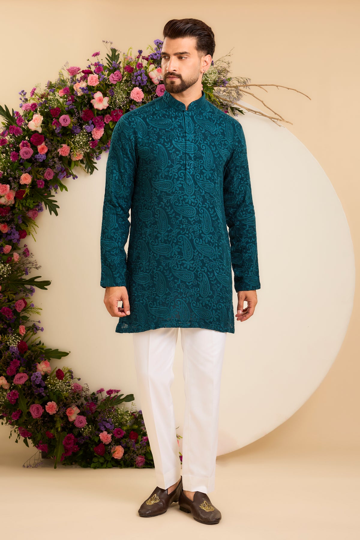 A Teal Short chikankari Kurta with Intricate Paisley Embroidery