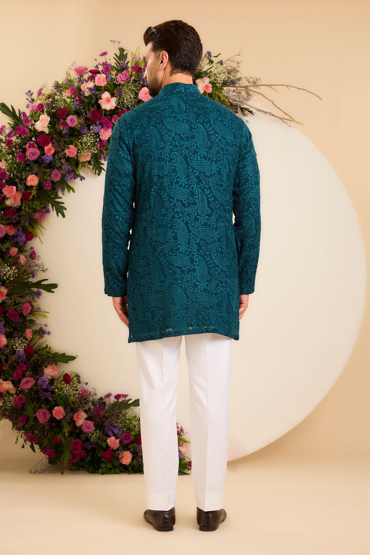 A Teal Short chikankari Kurta with Intricate Paisley Embroidery
