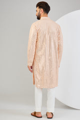 Classic pink mirror-work kurta.