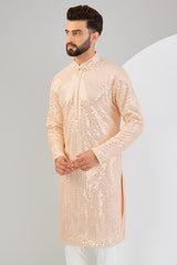 Classic pink mirror-work kurta.