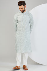 Powder blue chikankari kurta with detailed floral embroidery and tone-to-tone sequin work. - kasbahmen