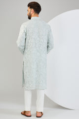 Powder blue chikankari kurta with detailed floral embroidery and tone-to-tone sequin work. - kasbahmen