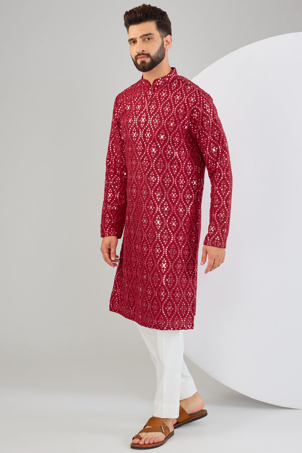 Signature red mirror-work kurta.