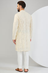 Classic cream mirror-work kurta with detailed neckline.