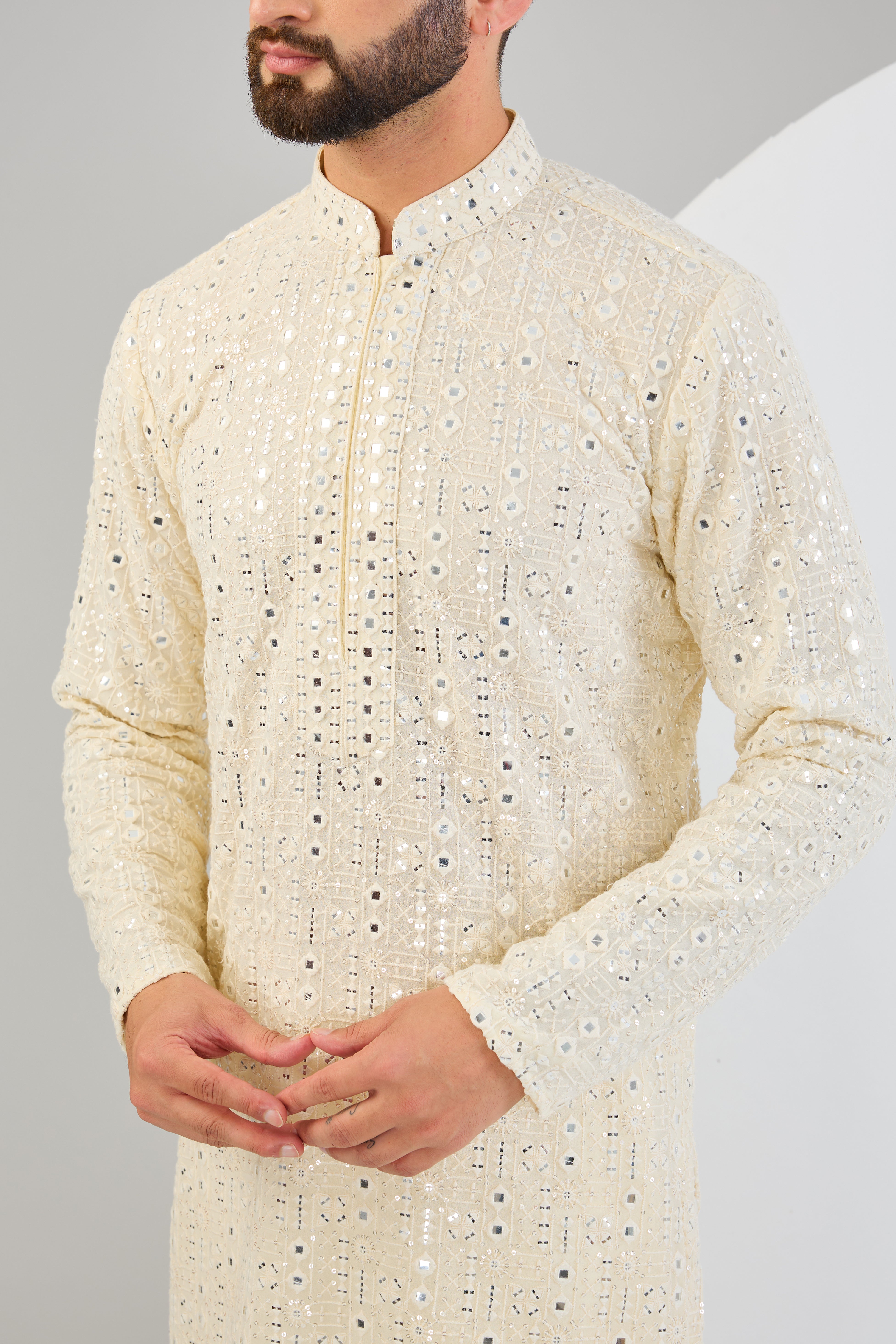 Classic cream mirror-work kurta with detailed neckline. - kasbahmen