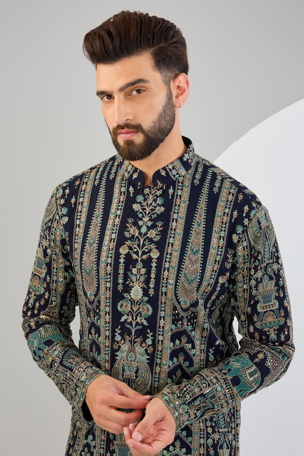 Navy blue chikankari kurta with intricate flora and fauna embroidery.