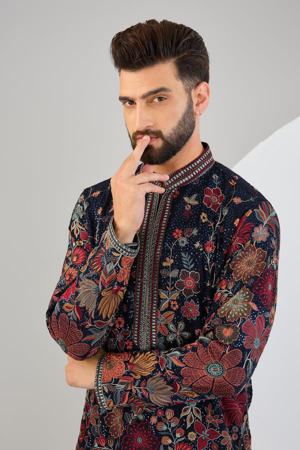 Navy blue chikankari kurta with floral embroidery.