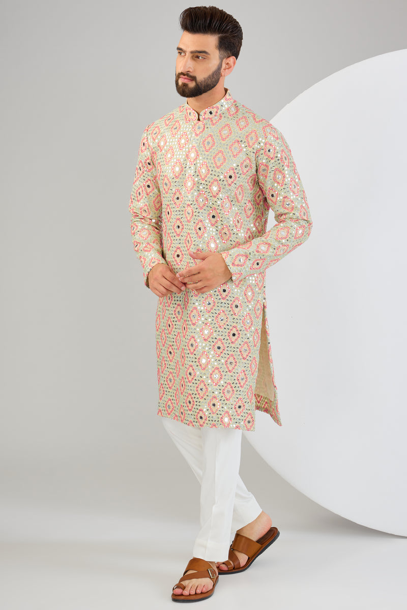 Signature cream mirror-work kurta with intricate mulit-thread work and zari-detailing.