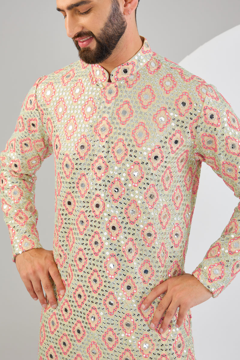 Signature cream mirror-work kurta with intricate mulit-thread work and zari-detailing.