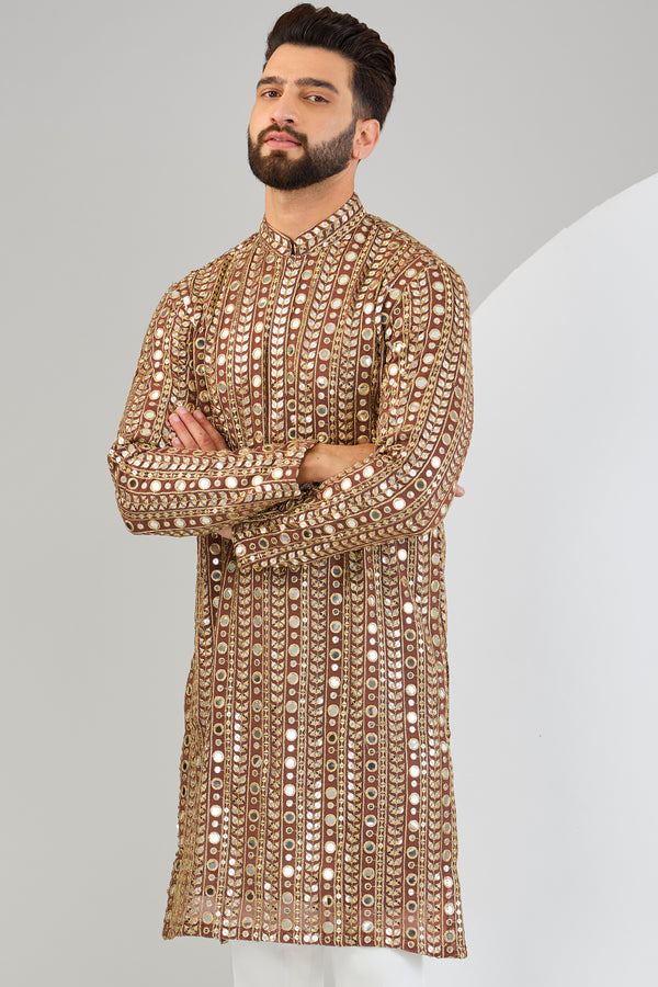 Dark brown mirror work with heavy golden zari embroidery. - kasbahmen