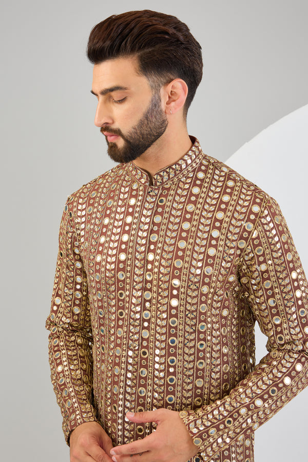 Dark brown mirror work with heavy golden zari embroidery. - kasbahmen