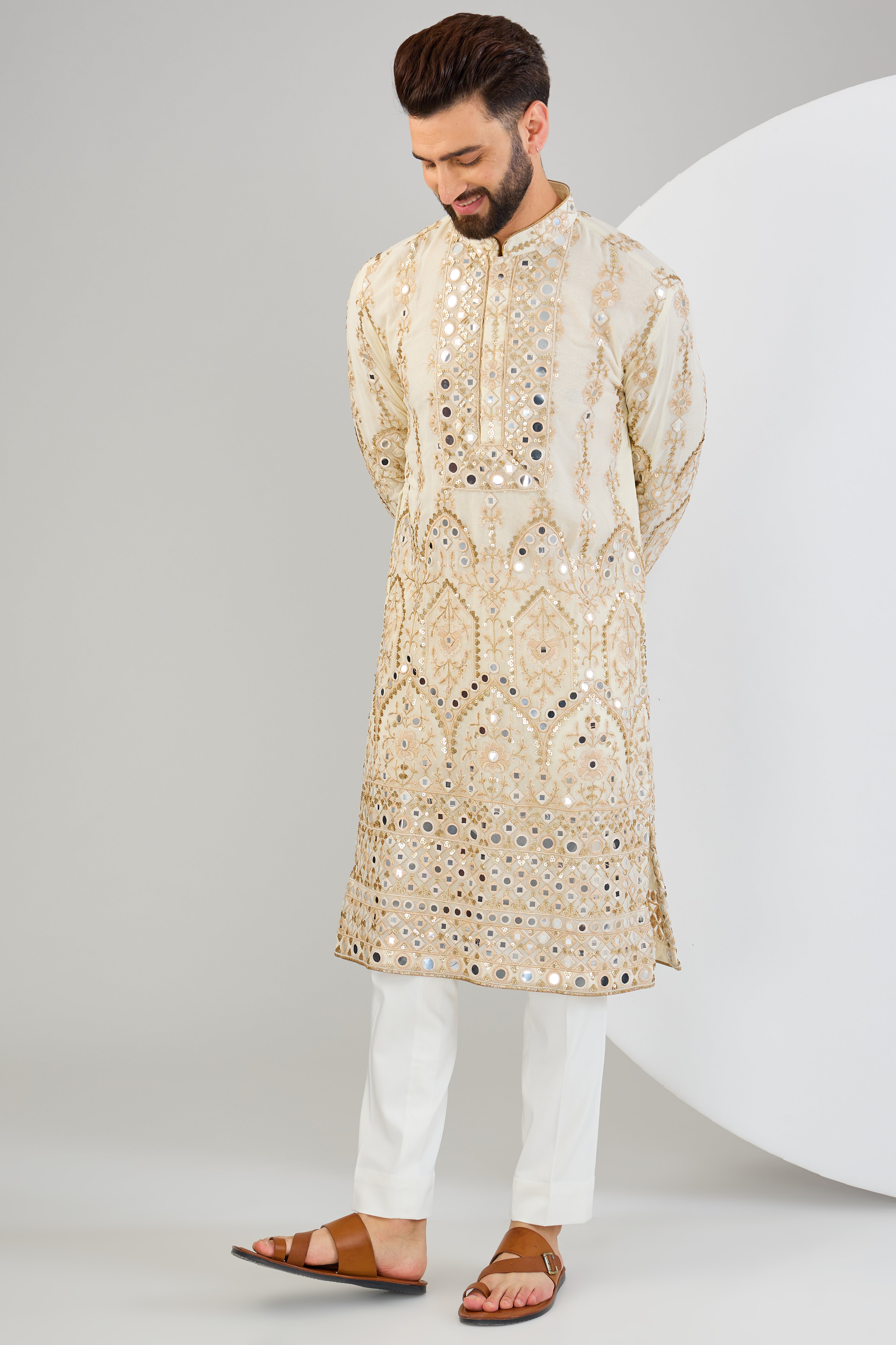 Cream mirror work kurta with detailed neckline and ghera with gold zari highlighting. - kasbahmen