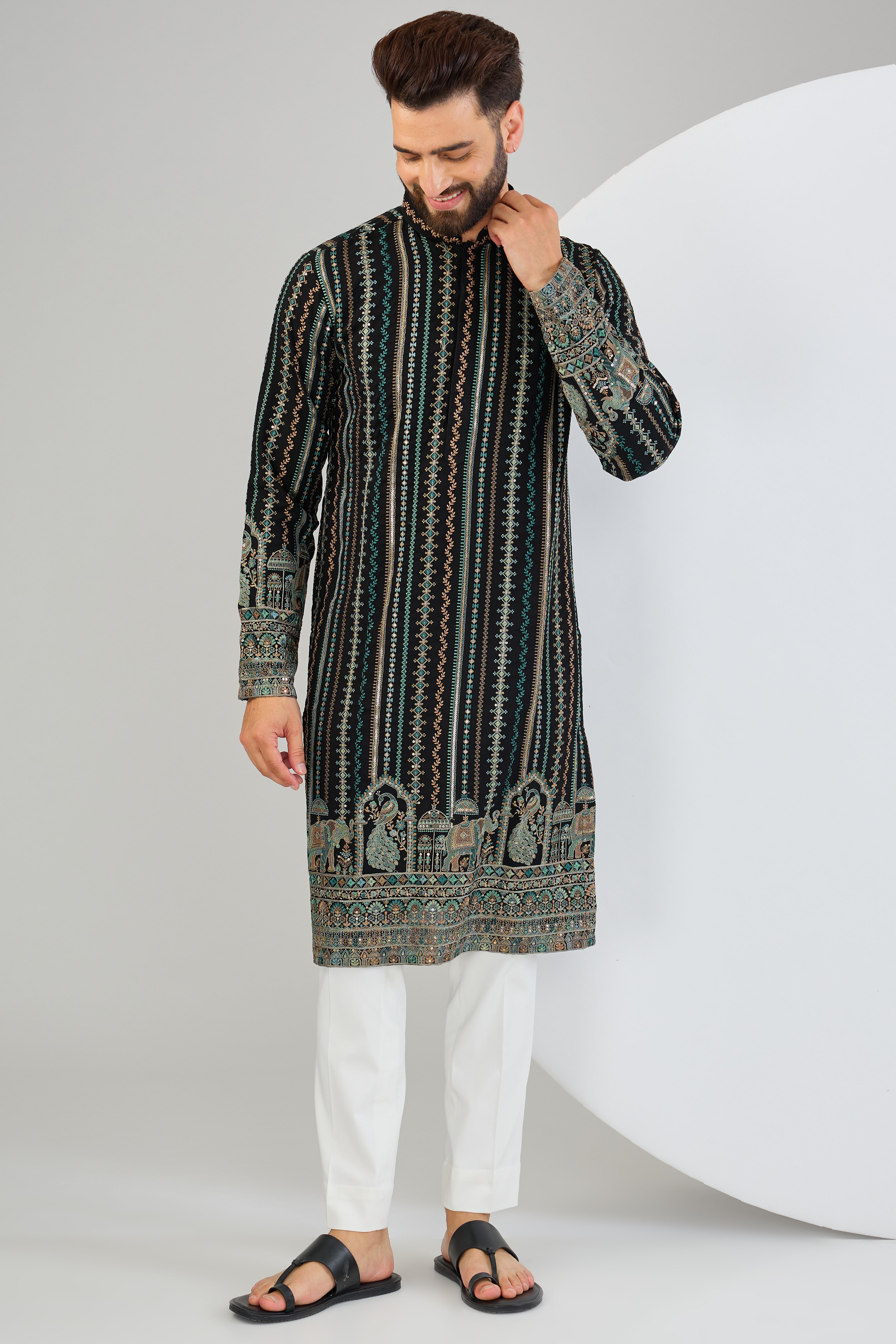 Black chikankari kurta with intricate multi-thread work and detailed kalamkari work on the ghera. - kasbahmen