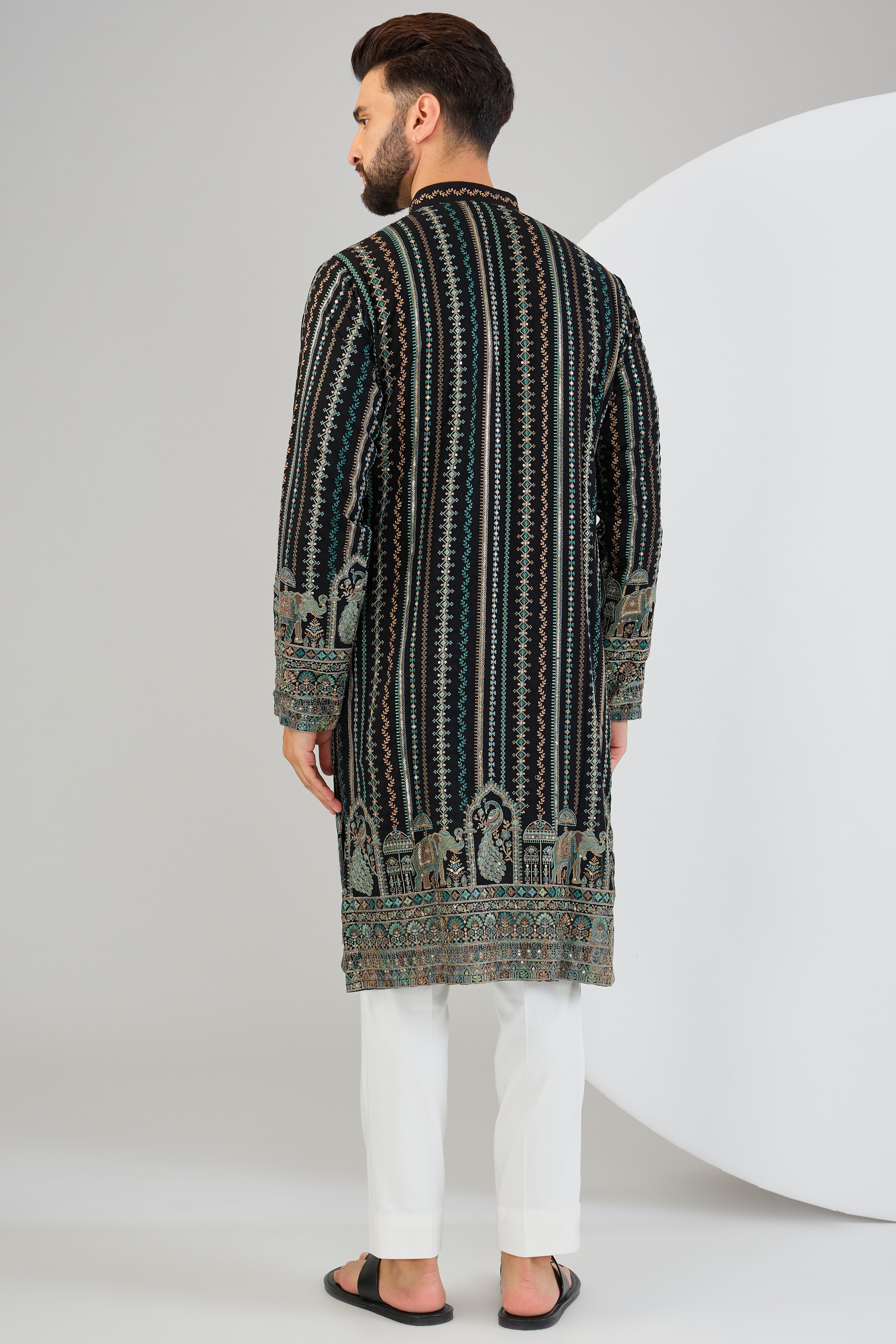 Black chikankari kurta with intricate multi-thread work and detailed kalamkari work on the ghera. - kasbahmen