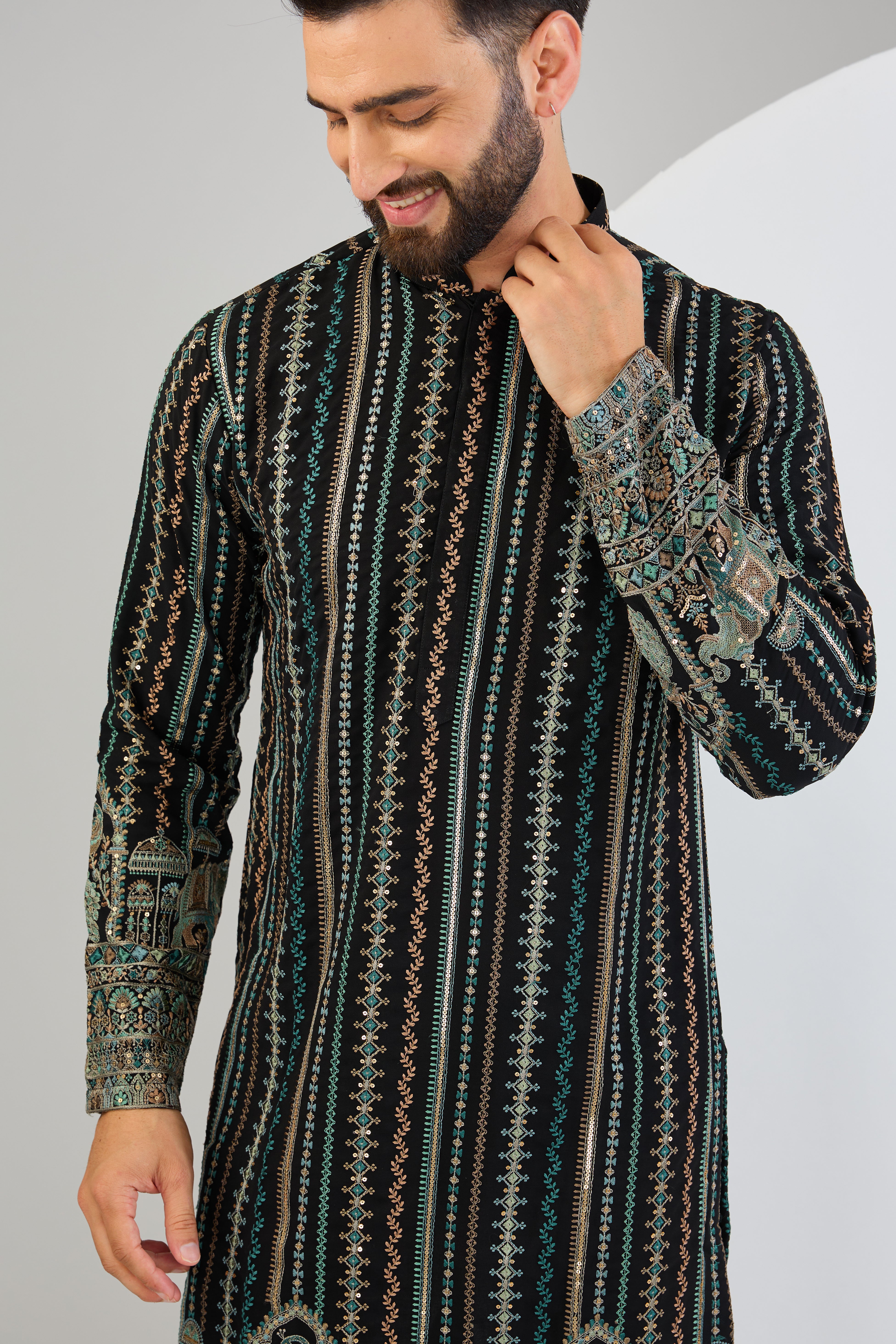 Black chikankari kurta with intricate multi-thread work and detailed kalamkari work on the ghera. - kasbahmen