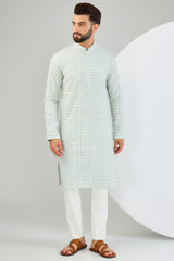 Powder blue chikankari kurta with heavy sequin work and intricate neckline. - kasbahmen