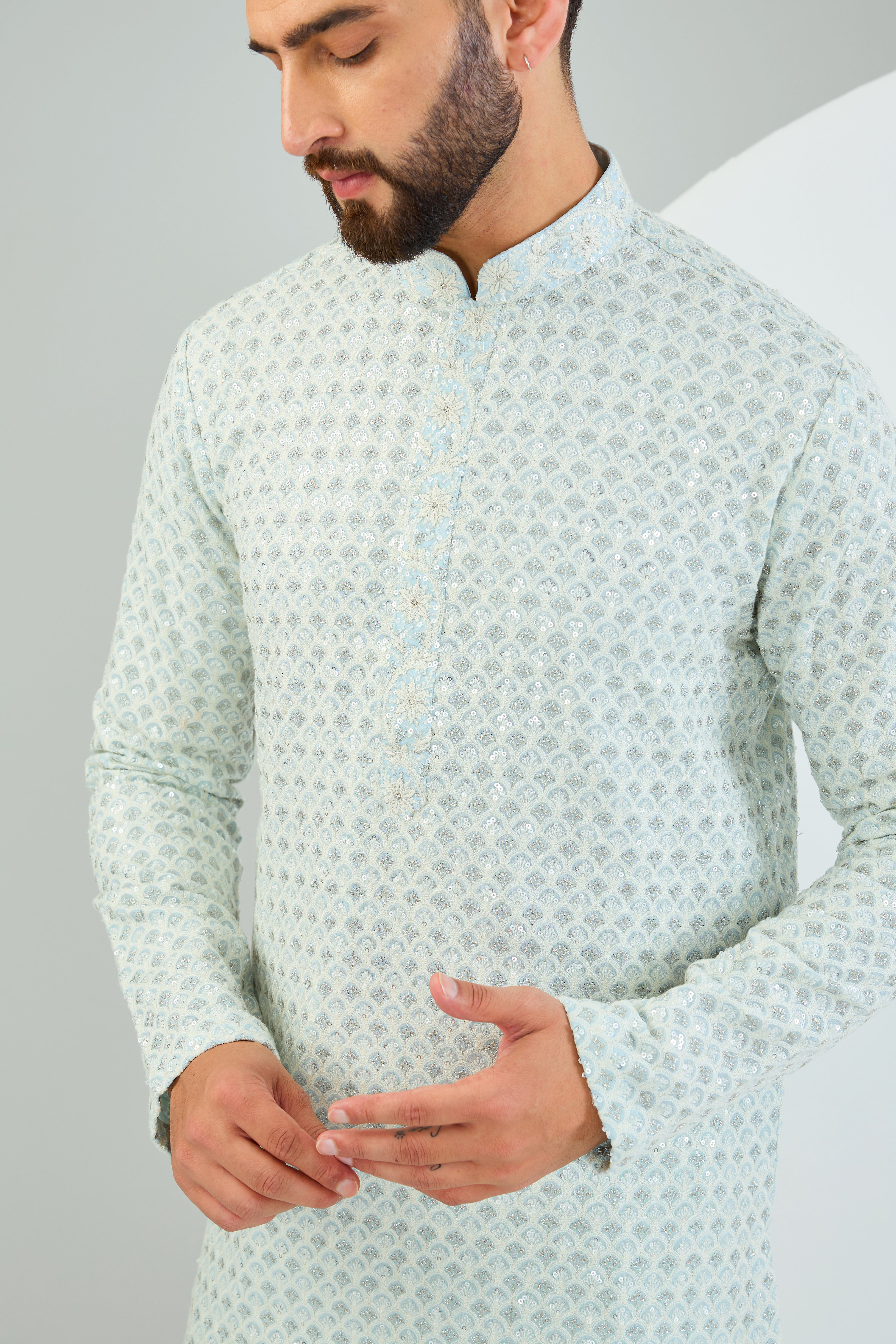 Powder blue chikankari kurta with heavy sequin work and intricate neckline. - kasbahmen