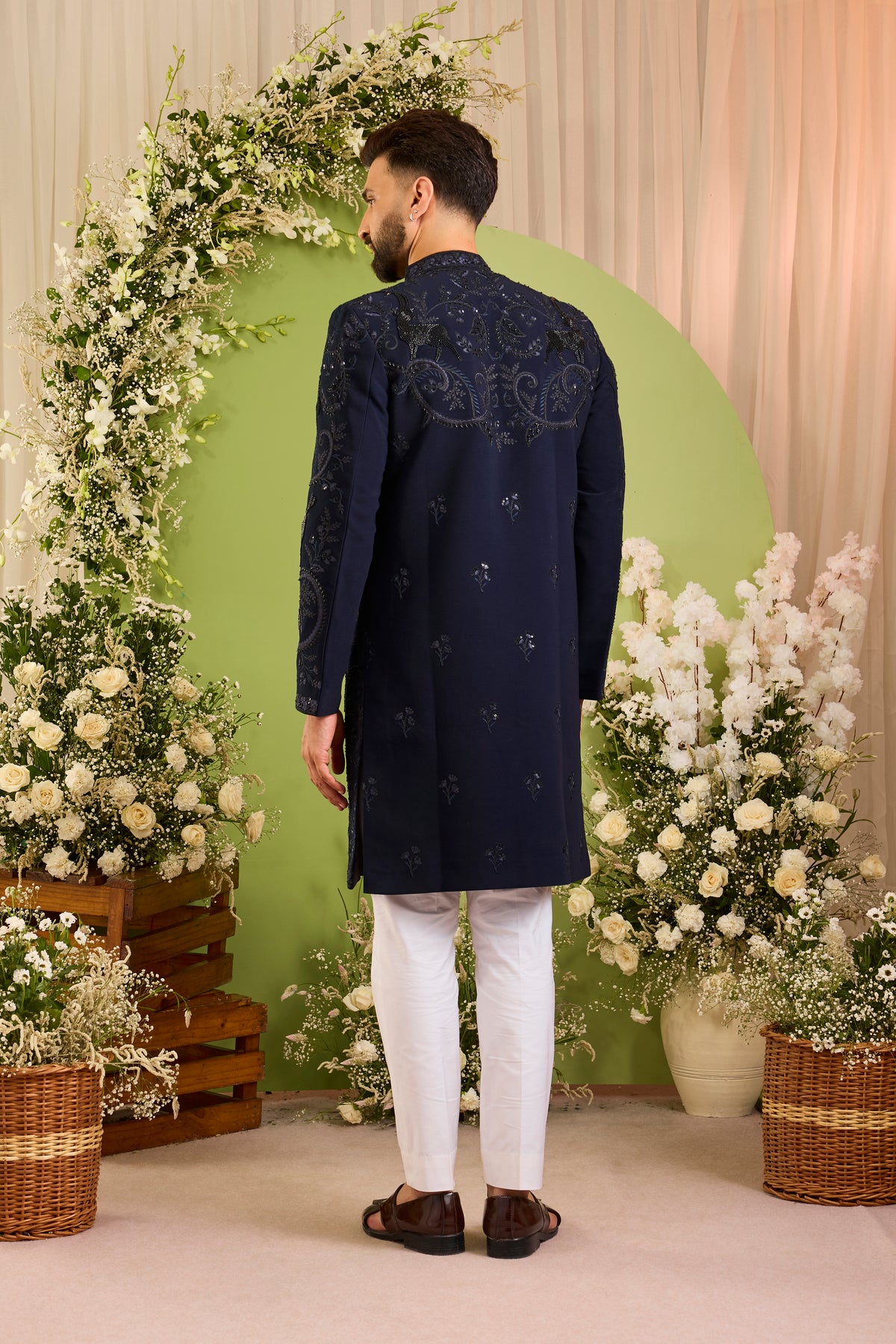 The Royal Crest - A Navy Sherwani Defined by Sculptural Deer Embroidery