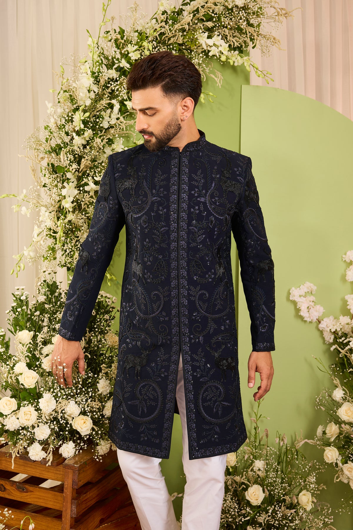 The Royal Crest - A Navy Sherwani Defined by Sculptural Deer Embroidery