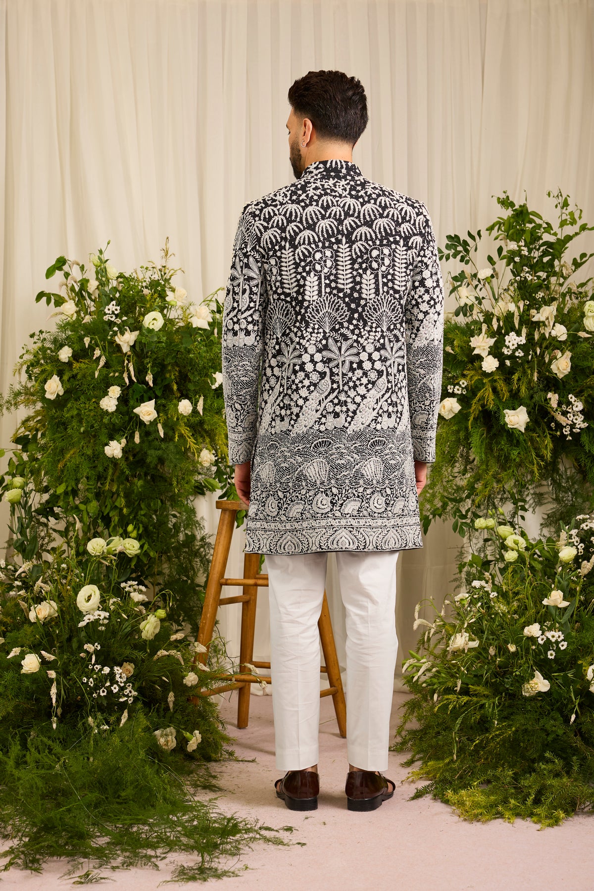 The Palais — A black Short Sherwani Richly Worked in Florals