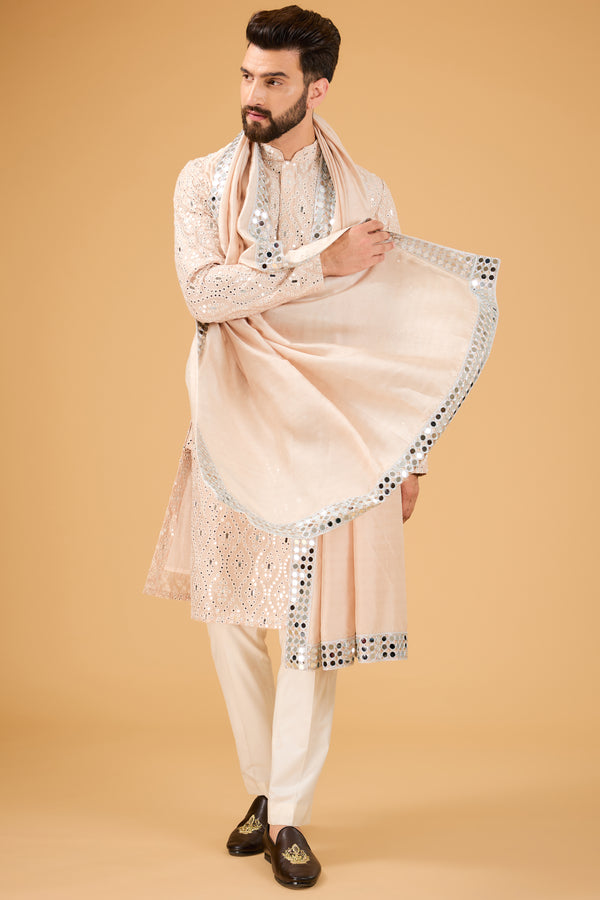 Signature cream-beige mirror work kurta paired with mirror-work stole.