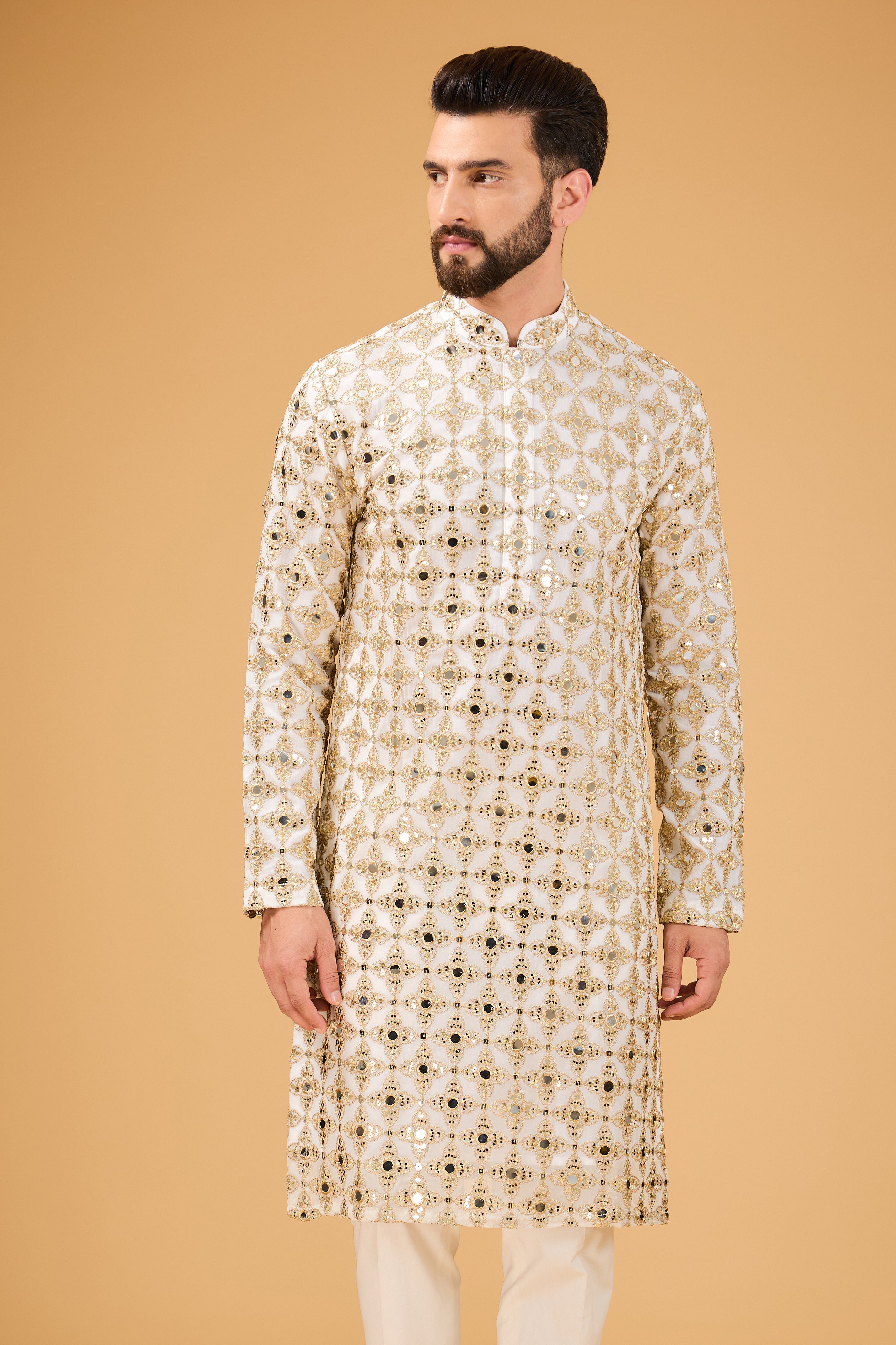 Signature mirror-work kurta with detailed golden zari embroidery. - kasbahmen