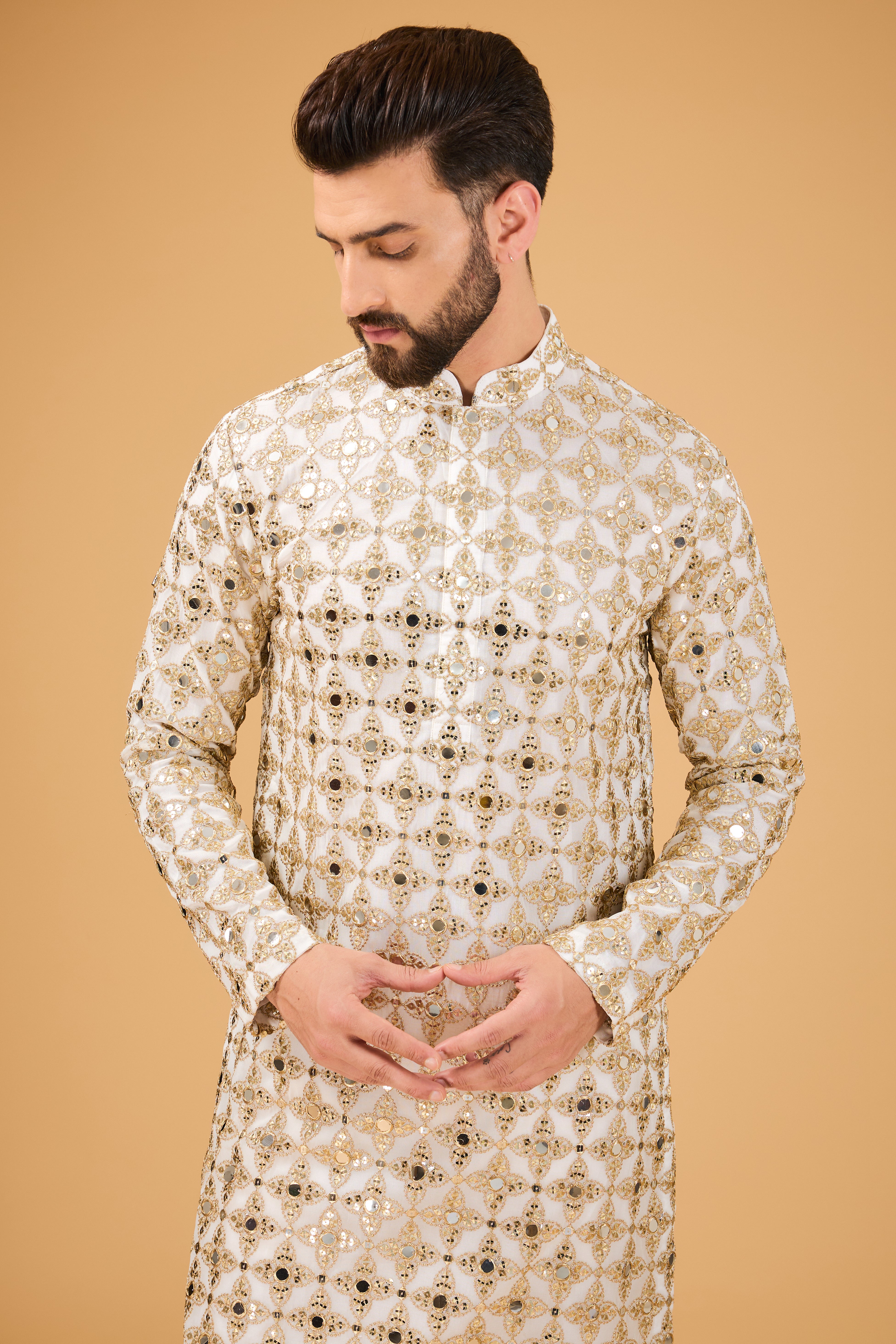 Signature mirror-work kurta with detailed golden zari embroidery. - kasbahmen