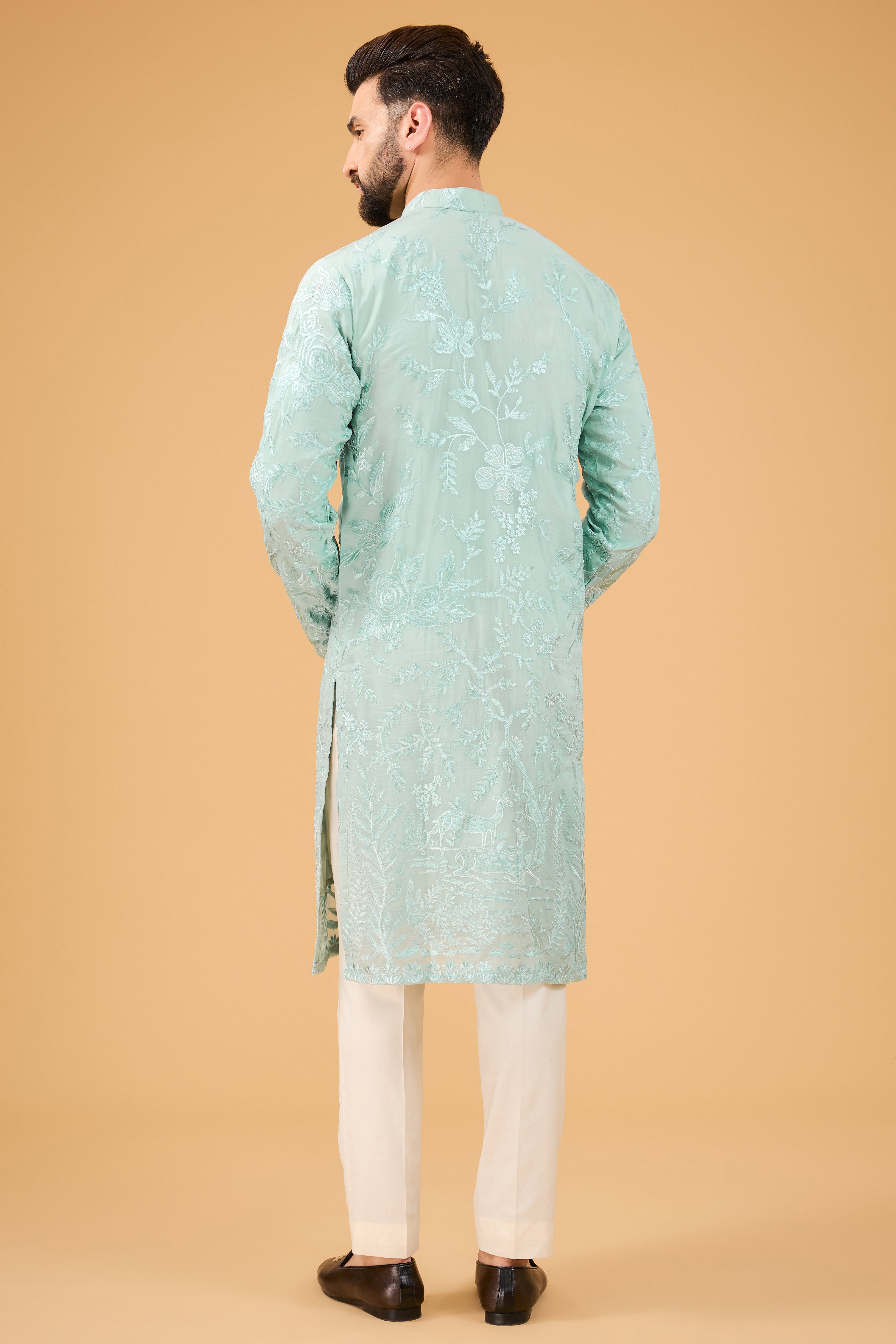 Blue thread-work kurta with detailed flora and fauna motifs. - kasbahmen