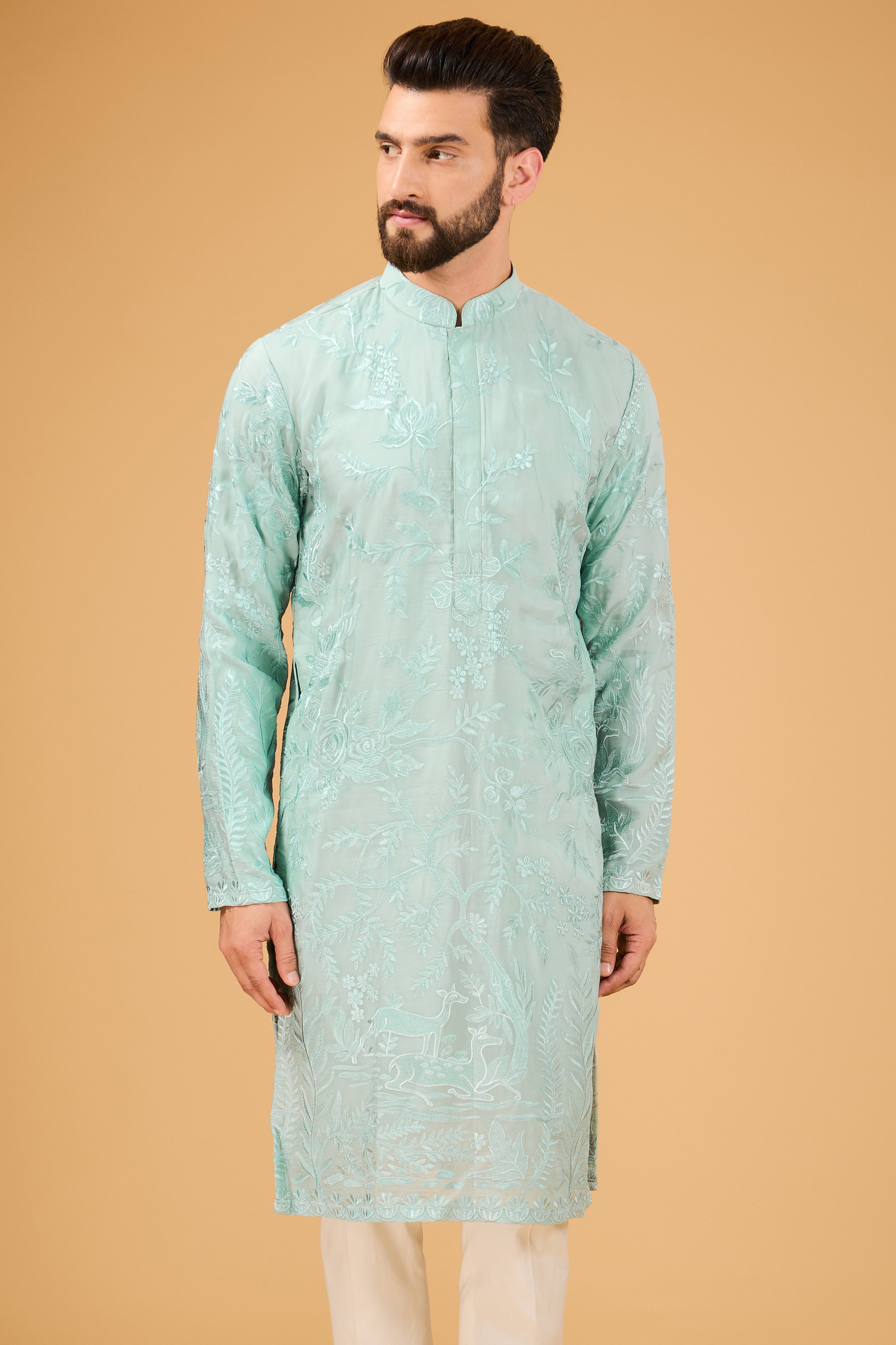 Blue thread-work kurta with detailed flora and fauna motifs. - kasbahmen