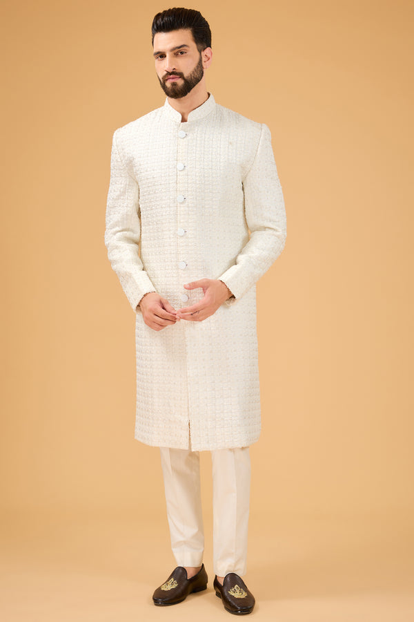 Ivory Sherwani featuring exquisite cut dana work