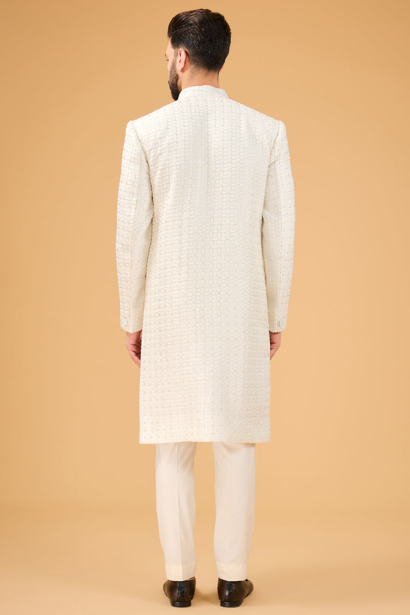 Ivory Sherwani featuring exquisite cut dana work