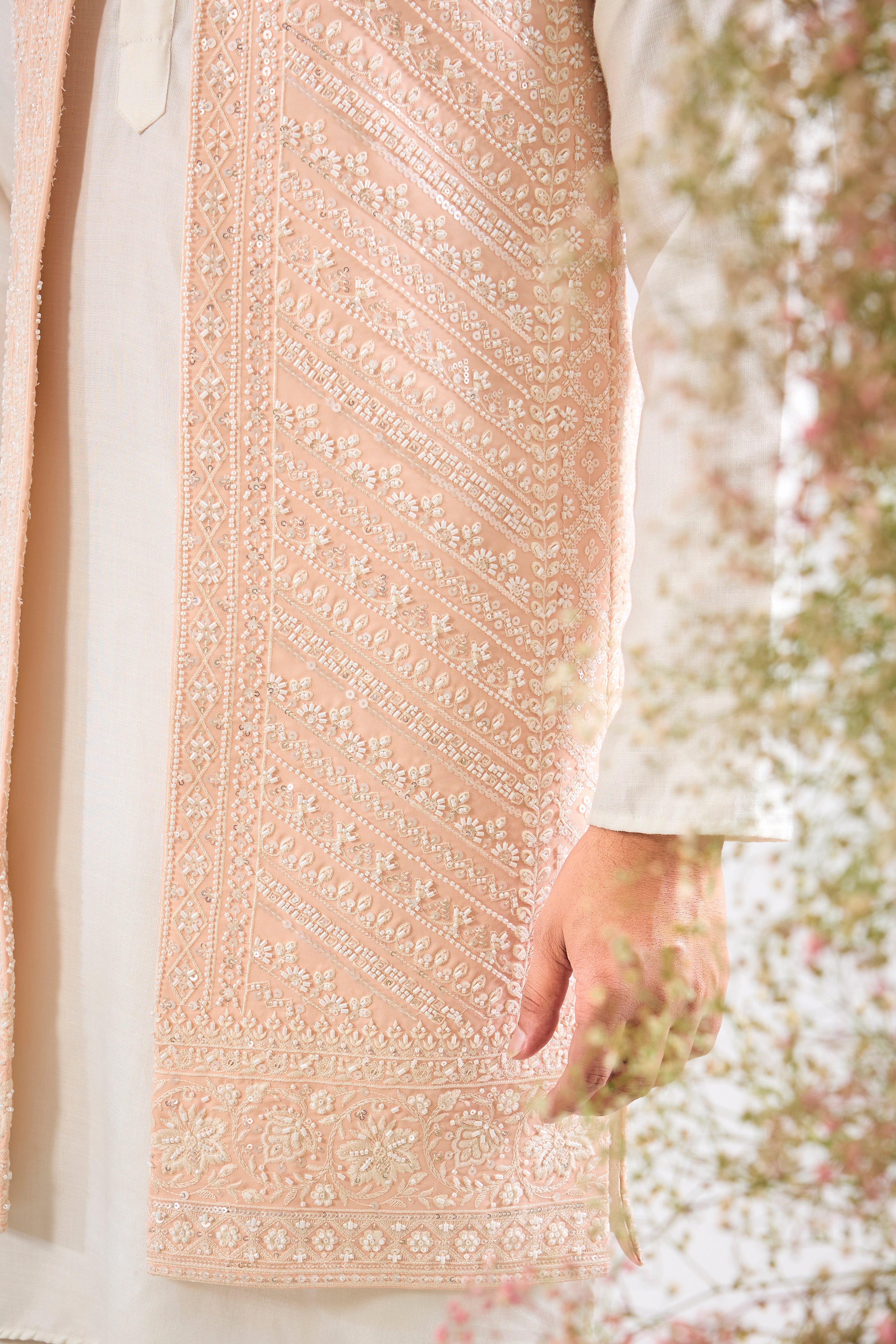 This stunning Pink Long Open Jacket is lavishly detailed with Intricate Hand Embroidered White Cut Dana work that catches the light beautifully.