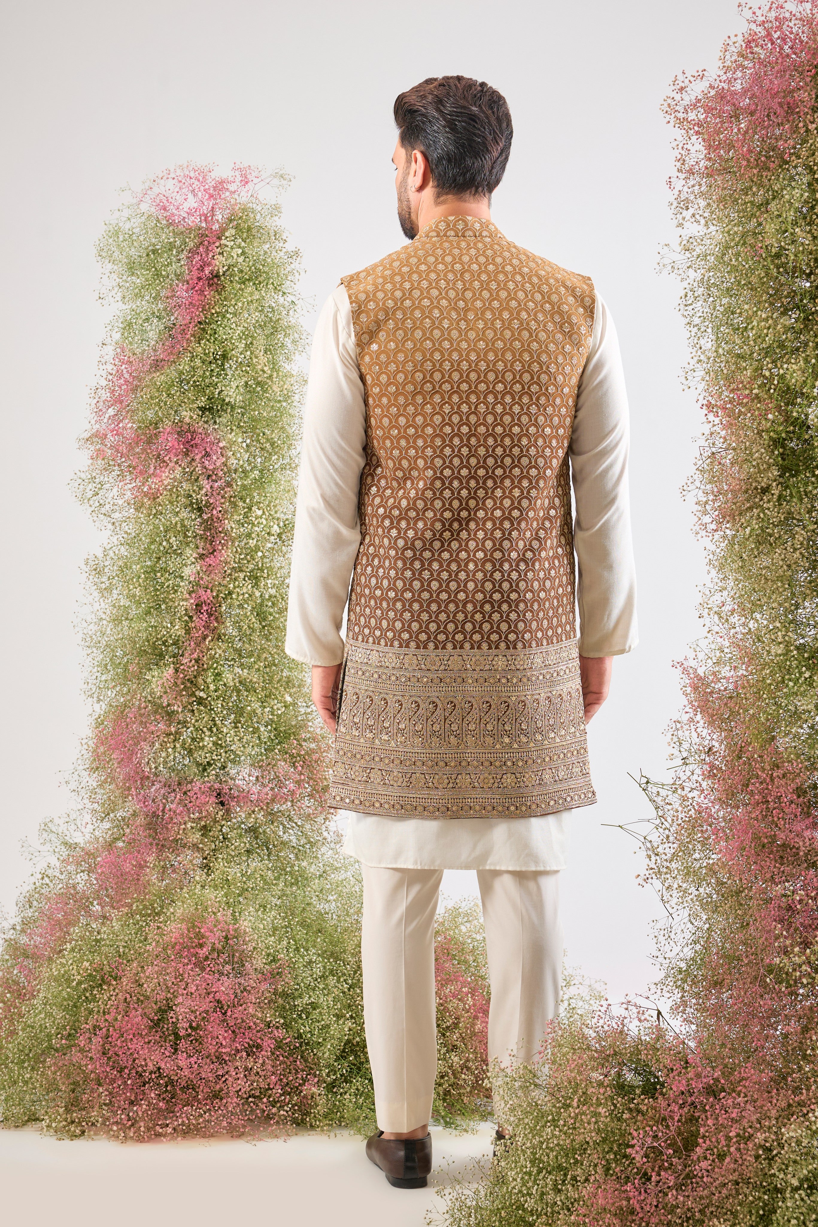 Deep, dazzling, and dramatic. Our Brown Ombre Long Open Jacket features breathtakingly Detailed Zari and Sequin Work. The perfect foundation for a royal entrance. 🤎