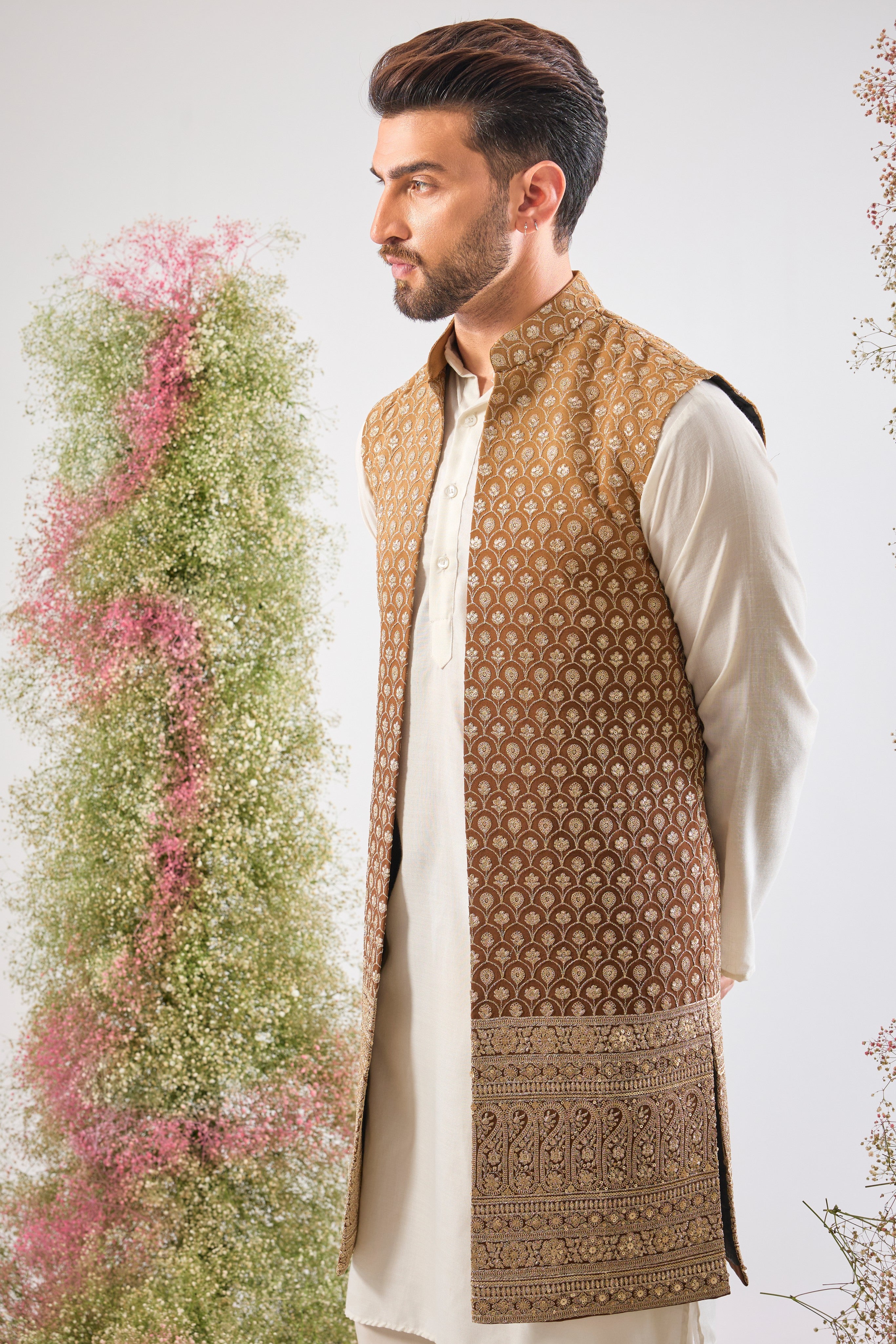 Deep, dazzling, and dramatic. Our Brown Ombre Long Open Jacket features breathtakingly Detailed Zari and Sequin Work. The perfect foundation for a royal entrance. 🤎