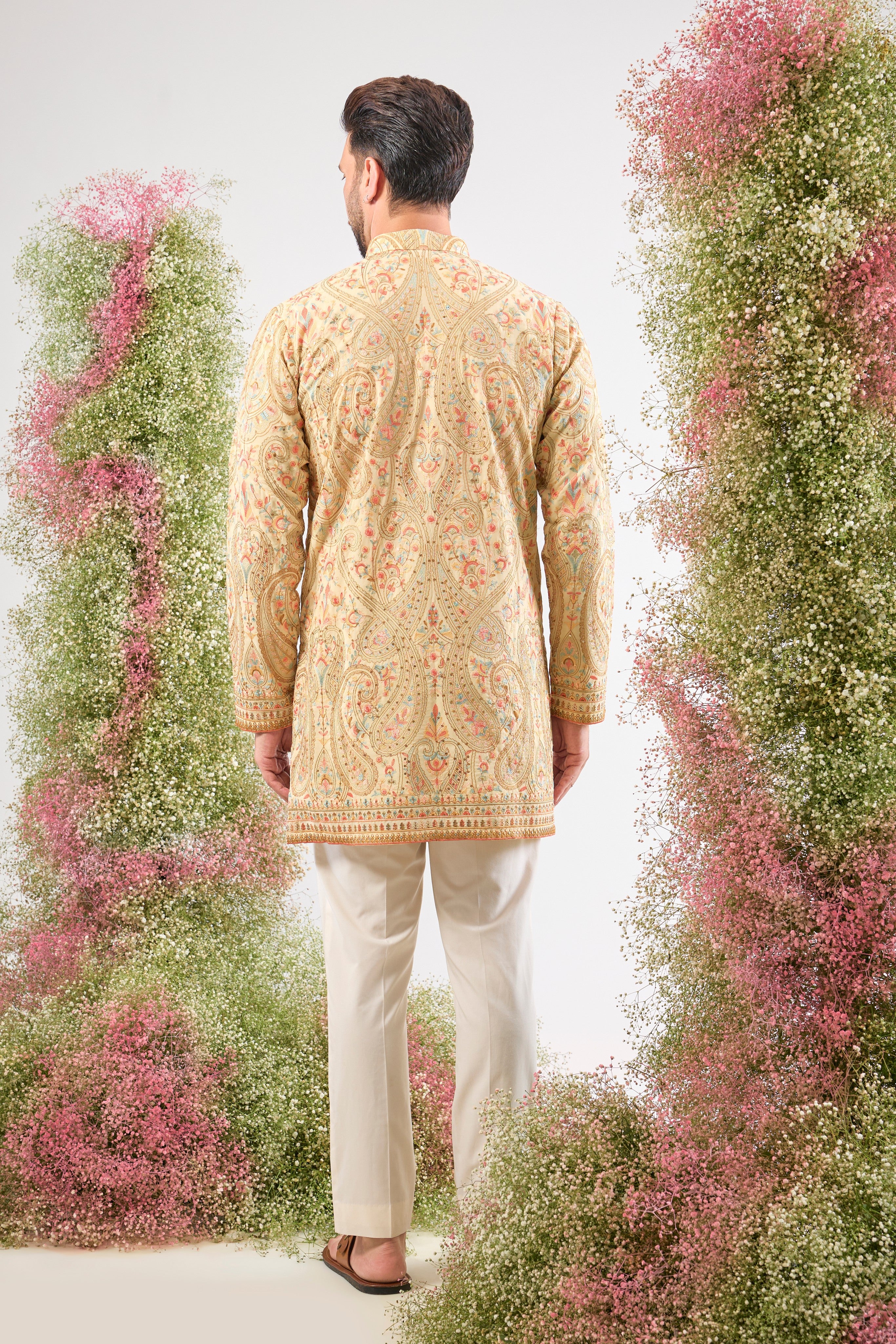 The perfect harmony of colour and craft! This Cream Kashmiri Embroidered Short Kurta showcases intricate patterns using a sophisticated blend of Multi-coloured Thread Work.