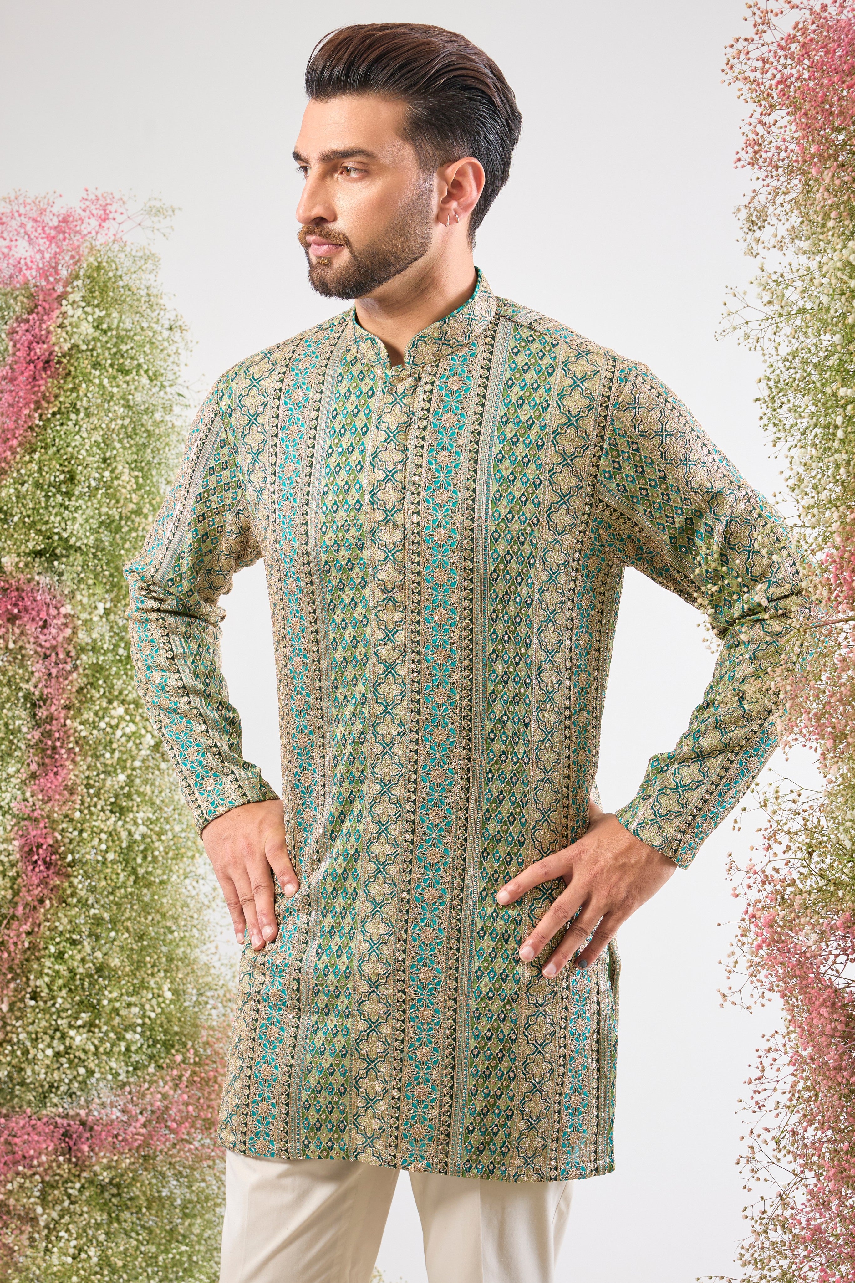 Our Turquoise-Multicoloured short Kurta features breathtaking Heavy Zari and detailed, intricate Sequin Embroidery. Get ready for the spotlight! 💖