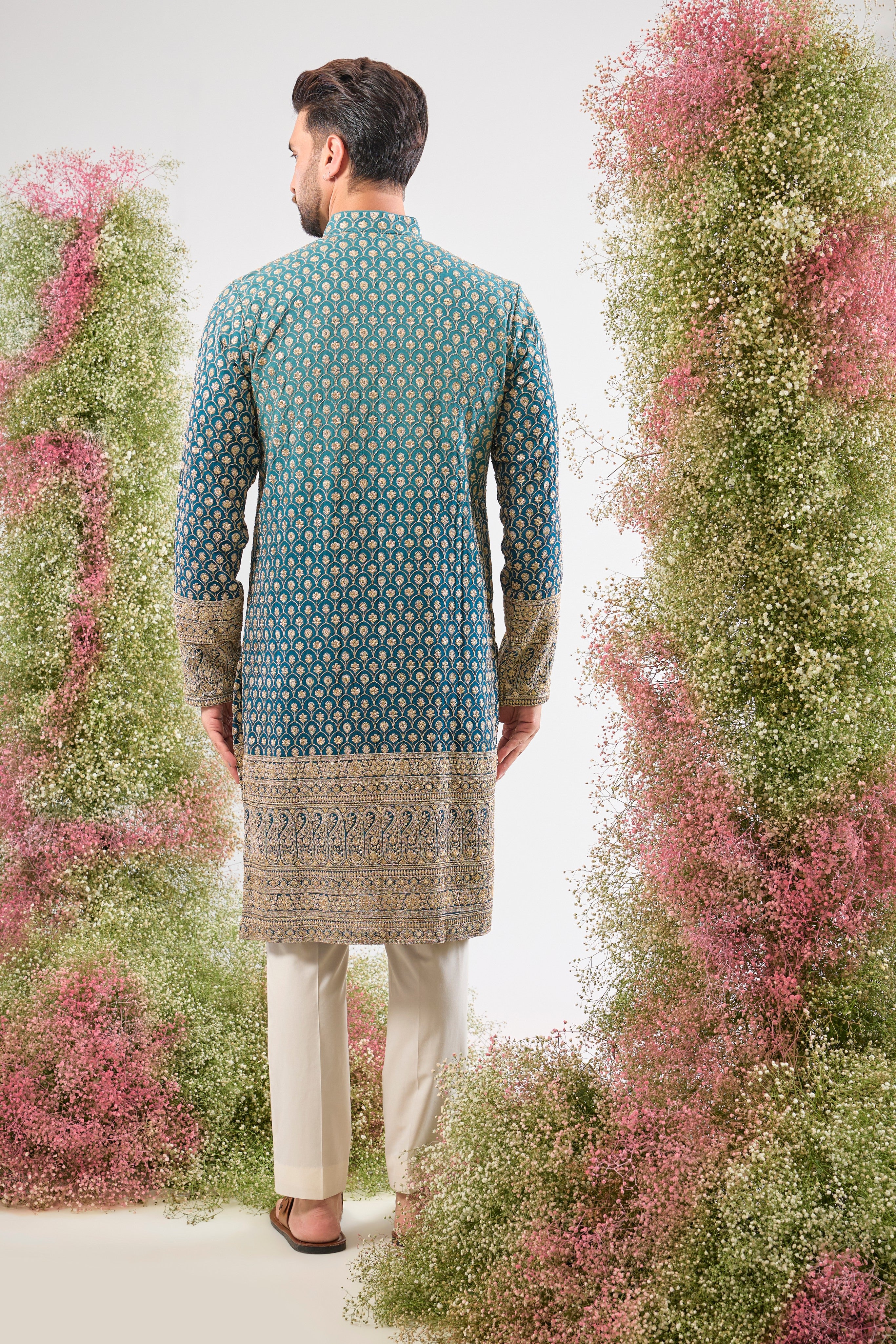 This Blue Ombre Shaded Kurta offers a stunning gradient effect, brought to life by the intense detailing of Intricate Zari and Sequin Work. The elegant, Heavy Ghera adds a traditional yet dramatic flair to your look. 👑