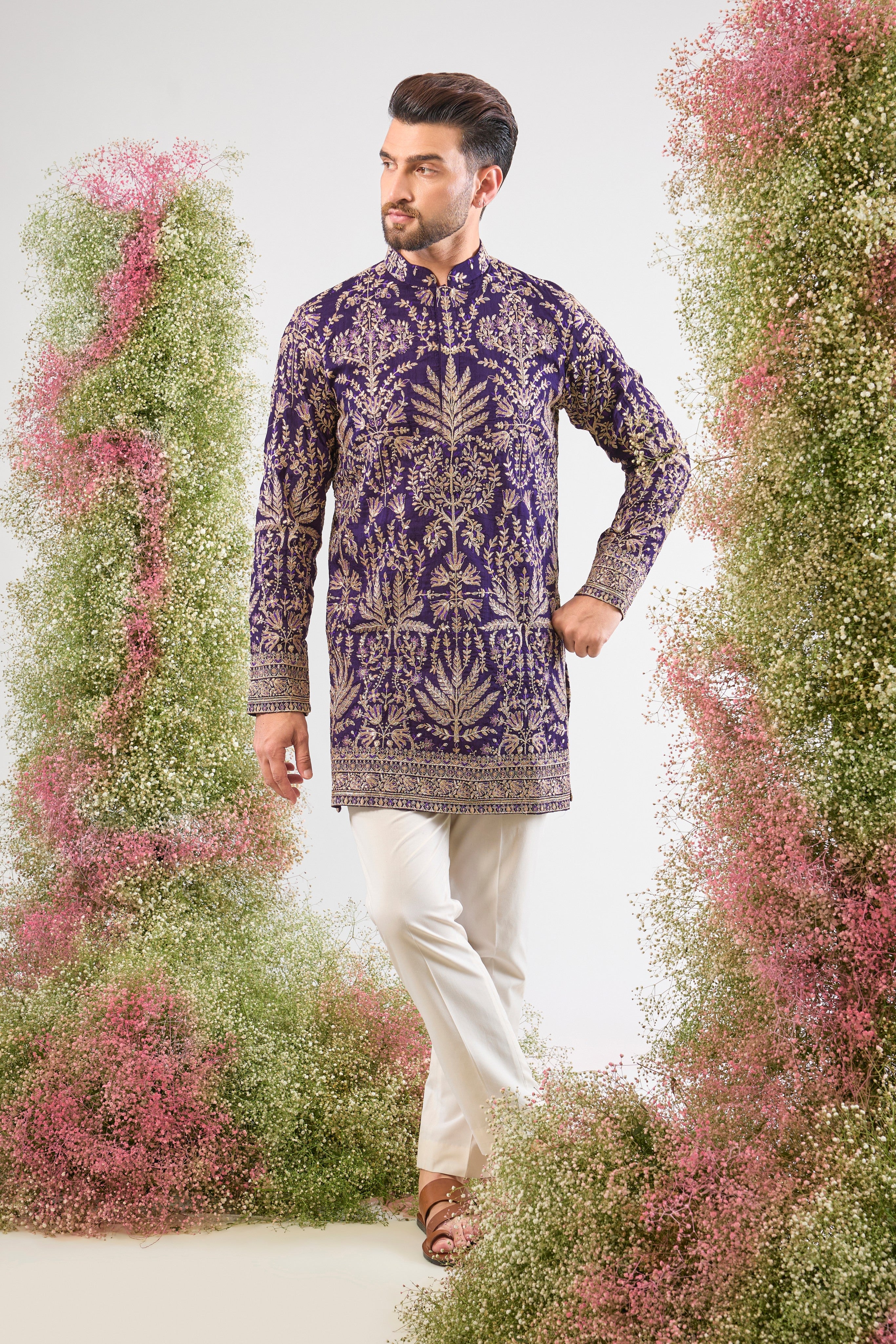 Purple perfection. Our Short Kurta shines with Heavy Zari Work, elegant Detailed Floral Embroidery, and a dash of Subtle Sequins. Unforgettable style.