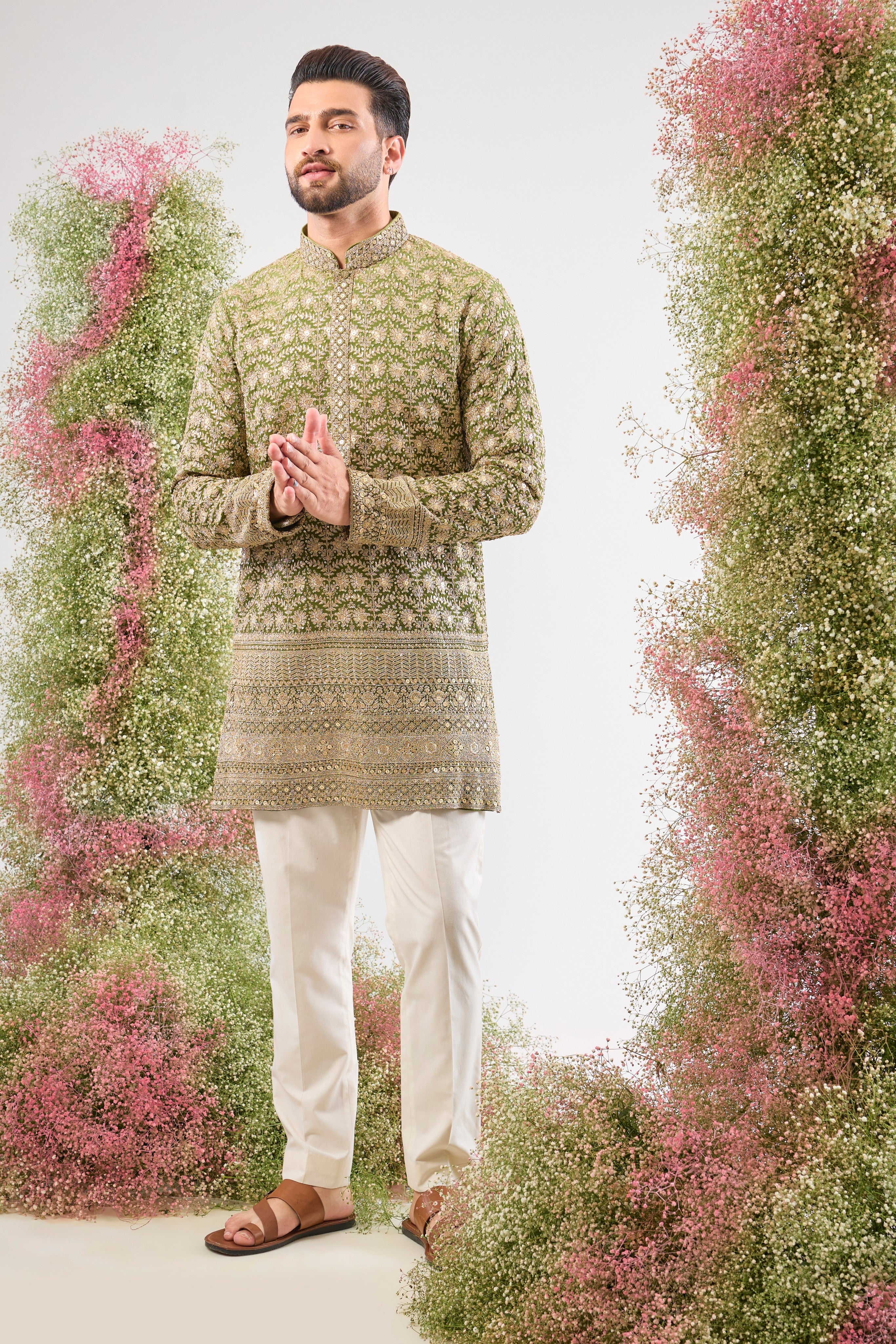 Our Green Ombre Shaded Kurta boasts a breathtaking silhouette, defined by its luxurious Heavy Zari Ghera (flare). The gradient green is richly covered in Heavy Zari Work and subtle Sequin Details, creating an aura of unparalleled festive elegance. ✨