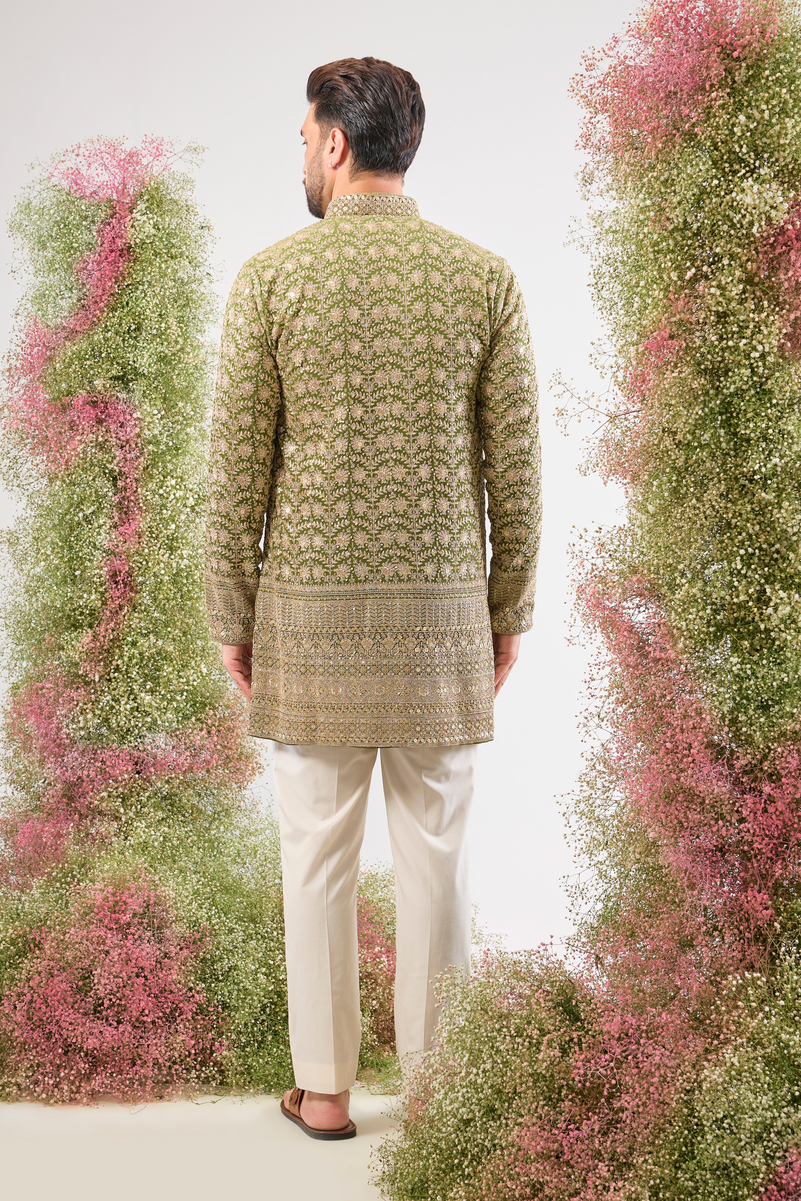 Our Green Ombre Shaded Kurta boasts a breathtaking silhouette, defined by its luxurious Heavy Zari Ghera (flare). The gradient green is richly covered in Heavy Zari Work and subtle Sequin Details, creating an aura of unparalleled festive elegance. ✨