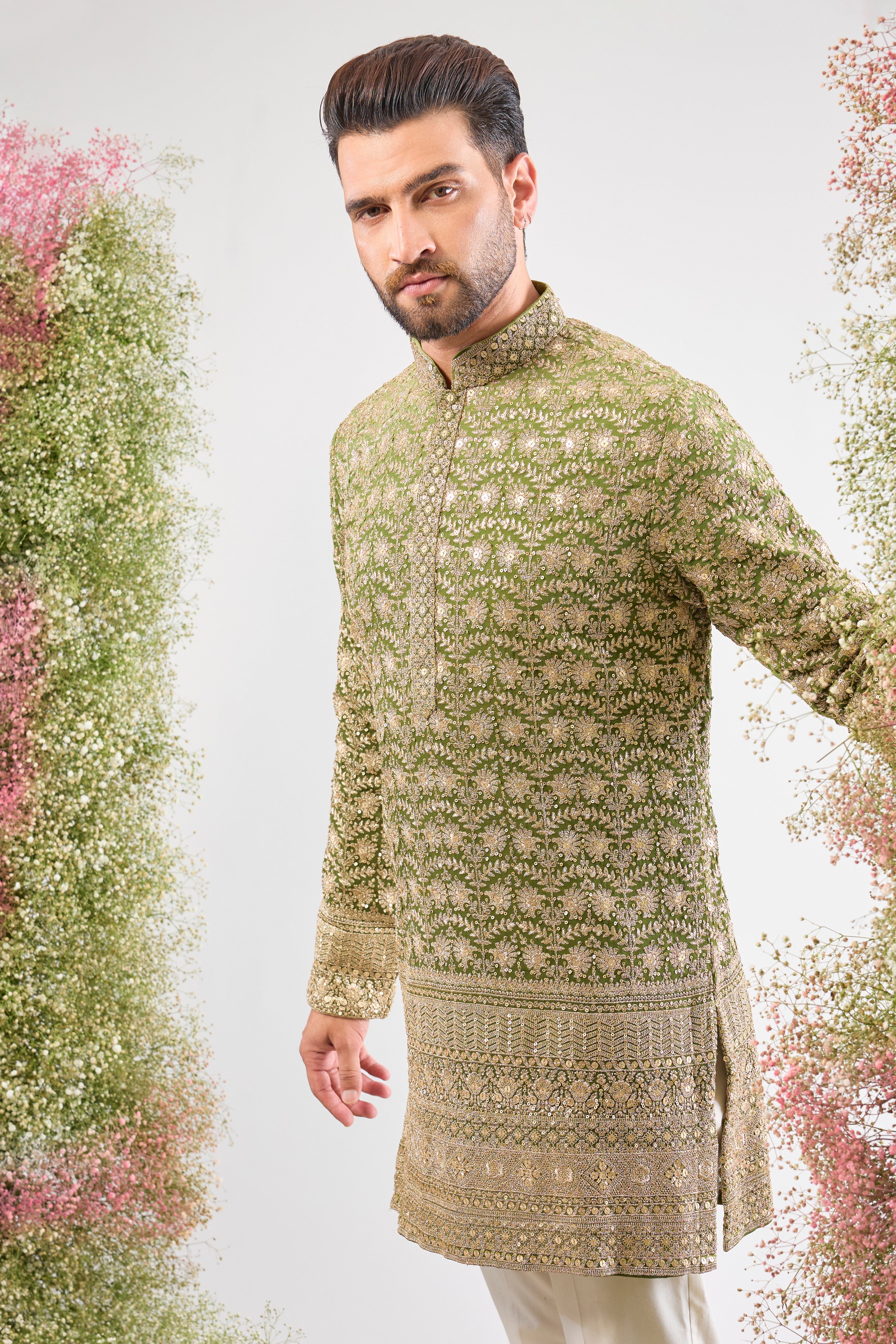 Our Green Ombre Shaded Kurta boasts a breathtaking silhouette, defined by its luxurious Heavy Zari Ghera (flare). The gradient green is richly covered in Heavy Zari Work and subtle Sequin Details, creating an aura of unparalleled festive elegance. ✨