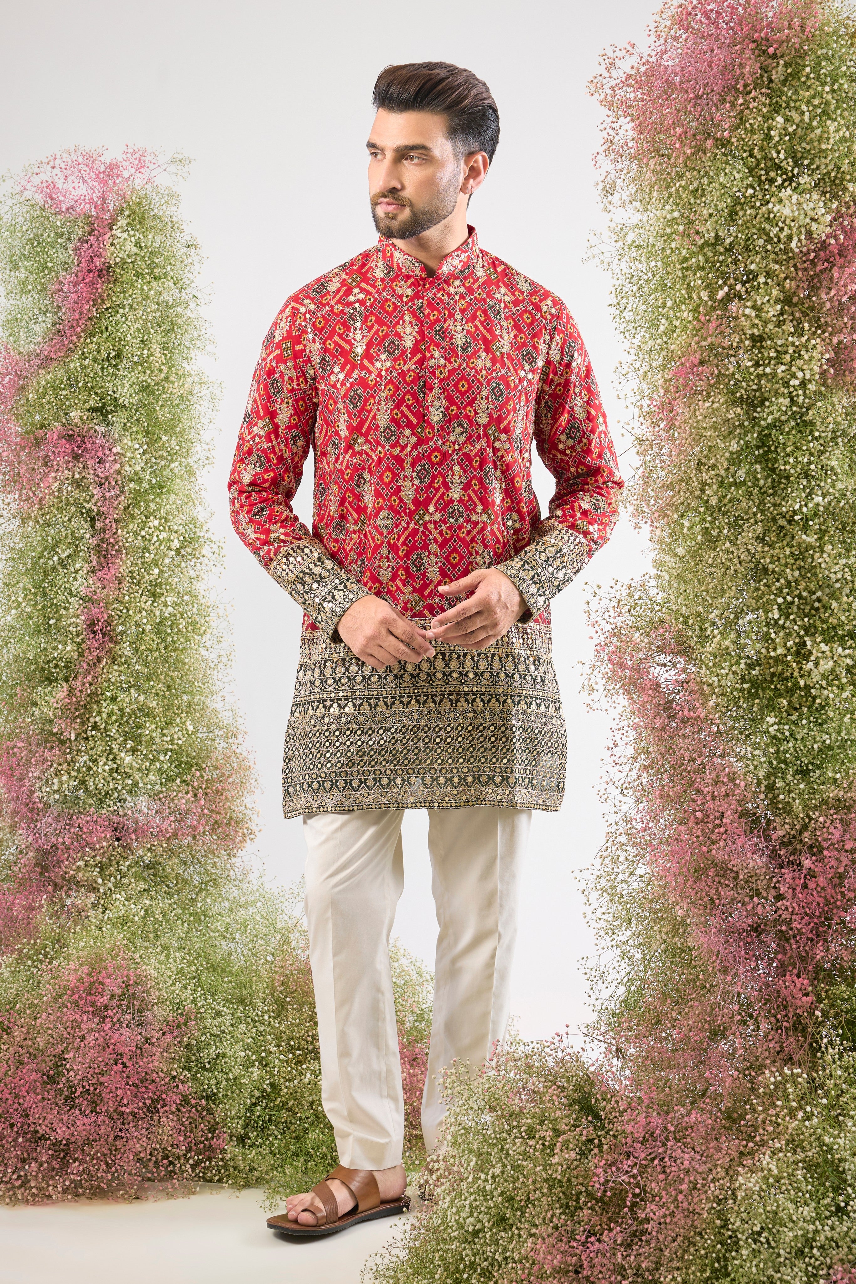 The perfect fusion! The classic appeal of Red Bandhani meets the grandeur of Intricate Zari and Sequin Work in this stunning Short Kurta. The textures and shine create a look of opulent elegance. 👑