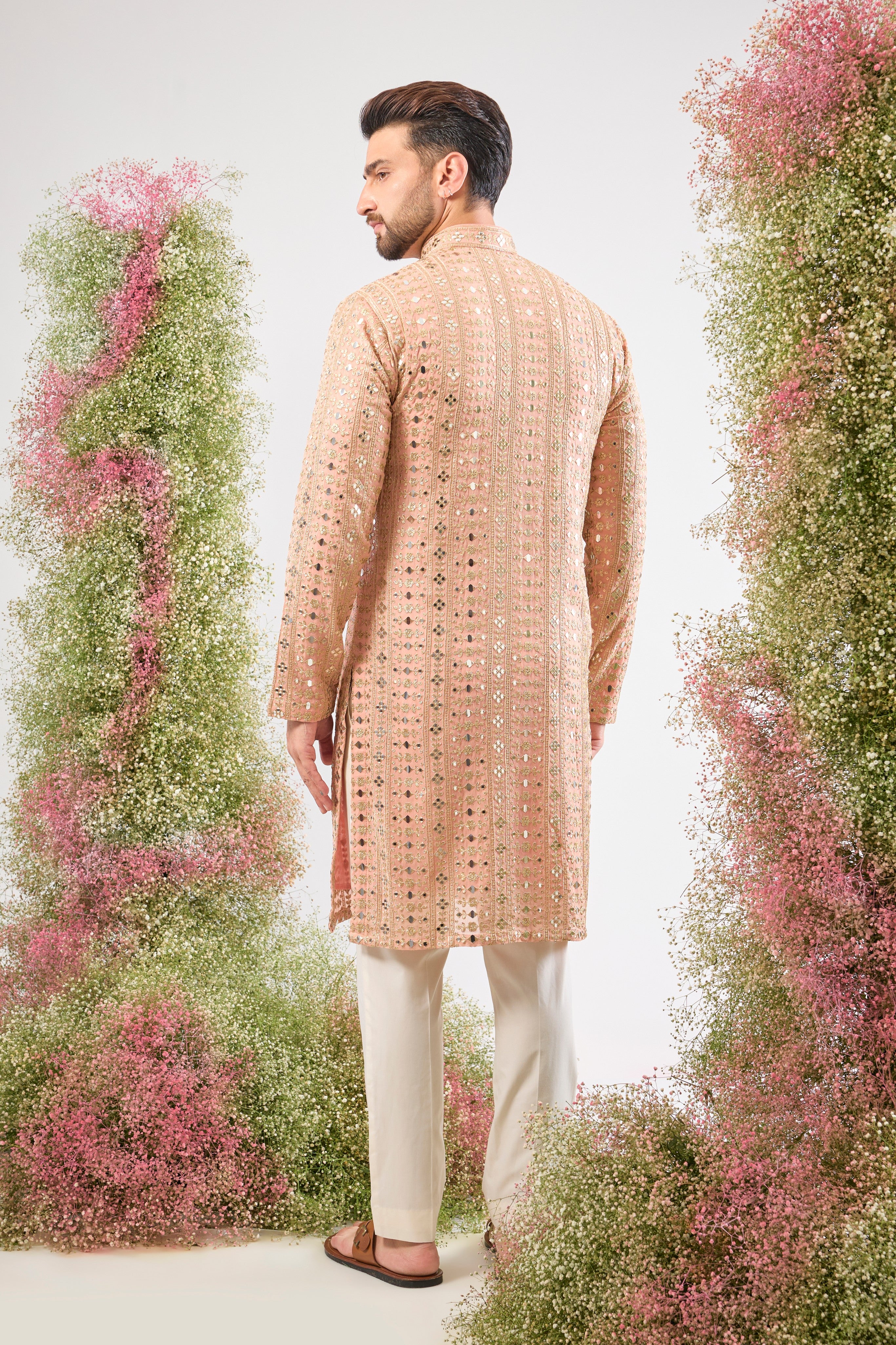 Dazzling peach. Maximum shine. Our Kurta features Heavy Sequin Work that mimics a mirror shine, complemented by Intricate Thread Work. You'll steal the show! 💫