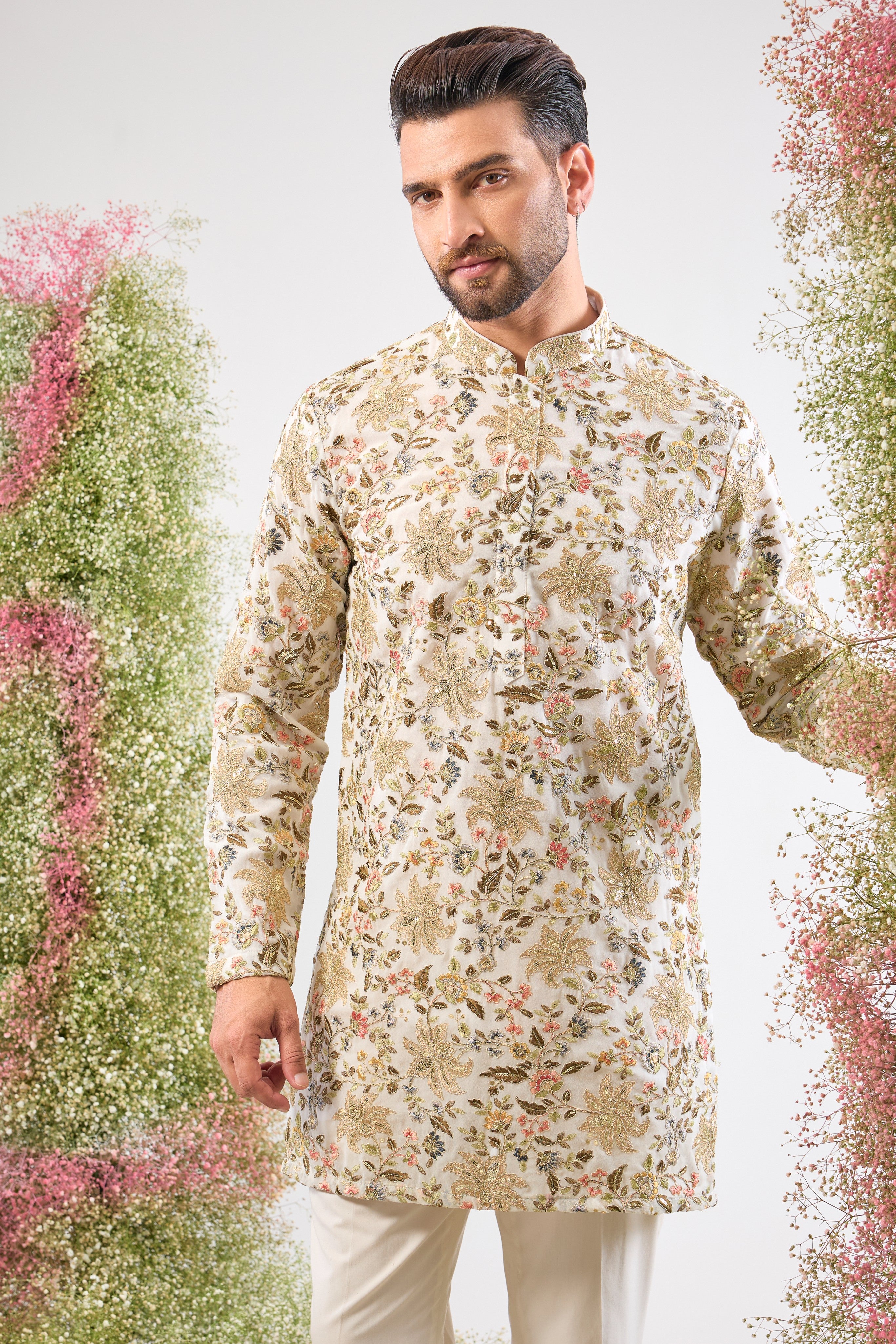 Purity meets precision. This White Short Kurta features dazzling sequins that provide texture and shimmer, while the Detailed Floral Embroidery adds a layer of intricate, handcrafted artistry.